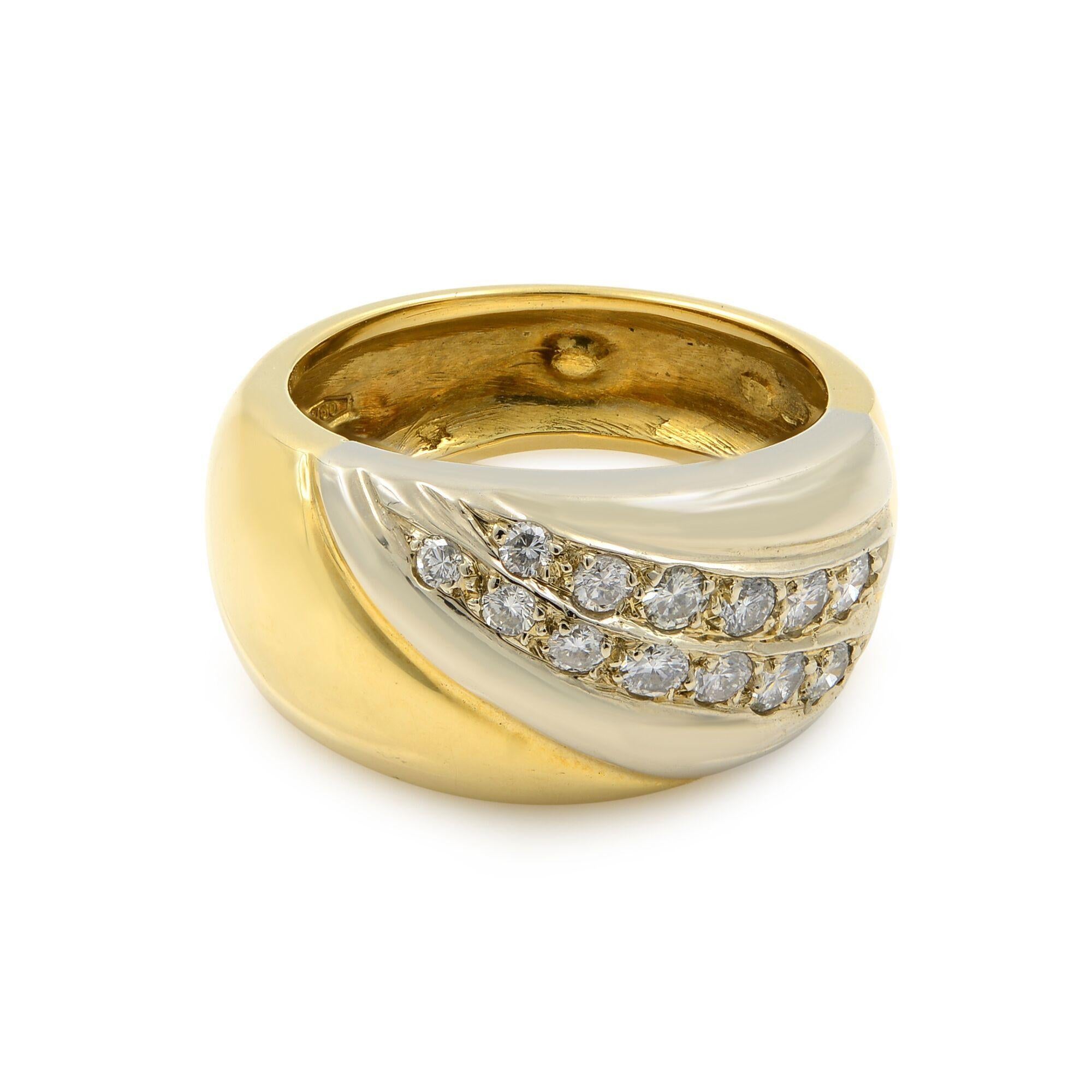 Our wide diamond band in 18K gold is made in two-tone gold. It is an appealing mix of smooth yellow gold and high polished white gold that has been encrusted with round brilliant cut diamonds. Diamonds are almost wrapping around the band creating a