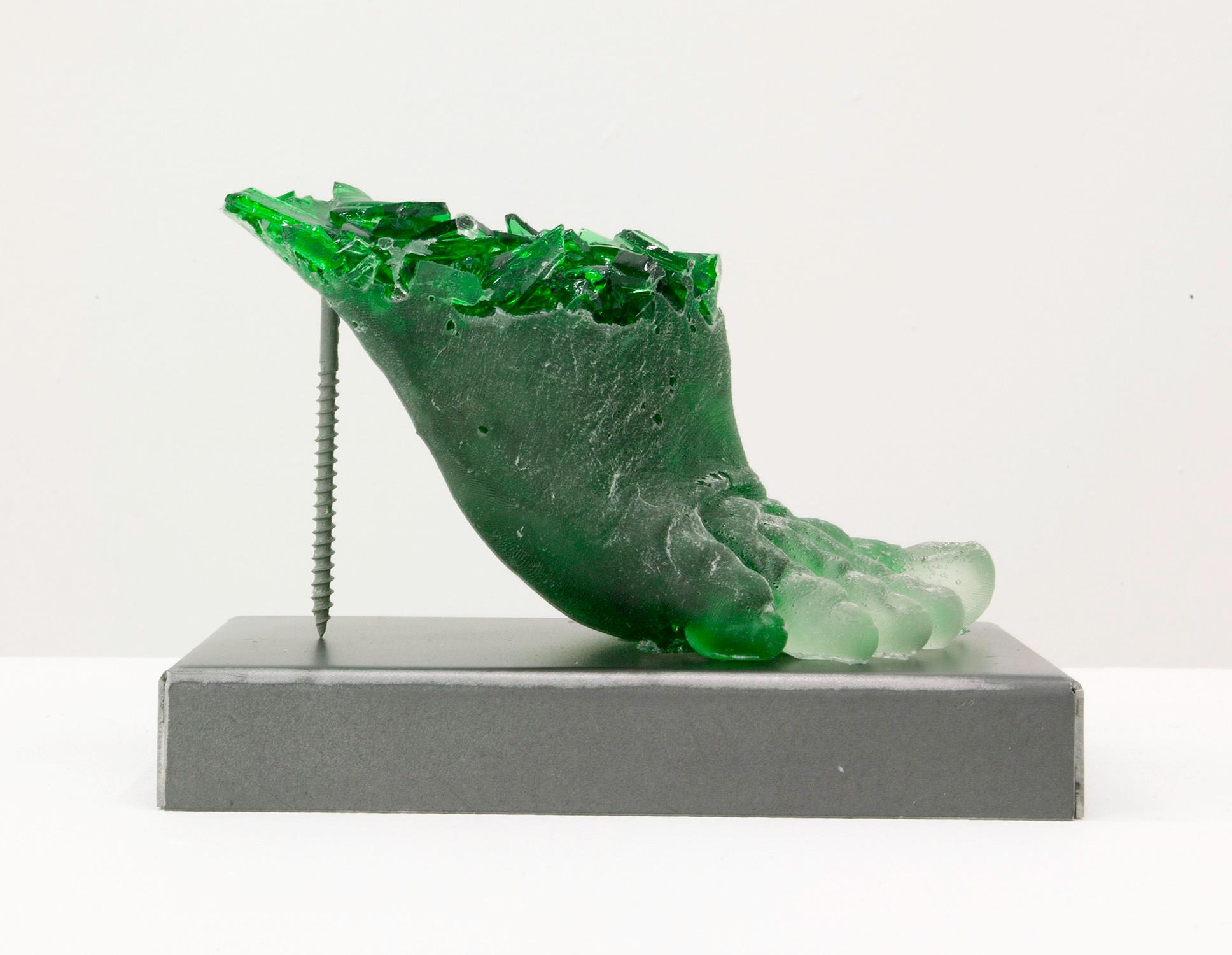 Rachel Owens, Footwear (Green Heel), 2015, Broken glass cast in resin with steel. Rachel Owens is known for her compelling works made with her signature process of casting broken shards of bottle glass. Here, she cast the glass in a mold made from