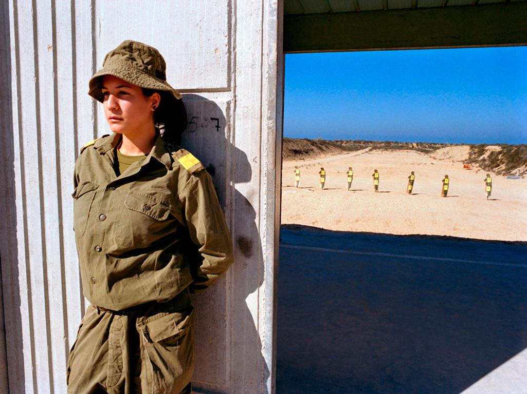 Rachel Papo Color Photograph - Guarding the entrance to the shooting range