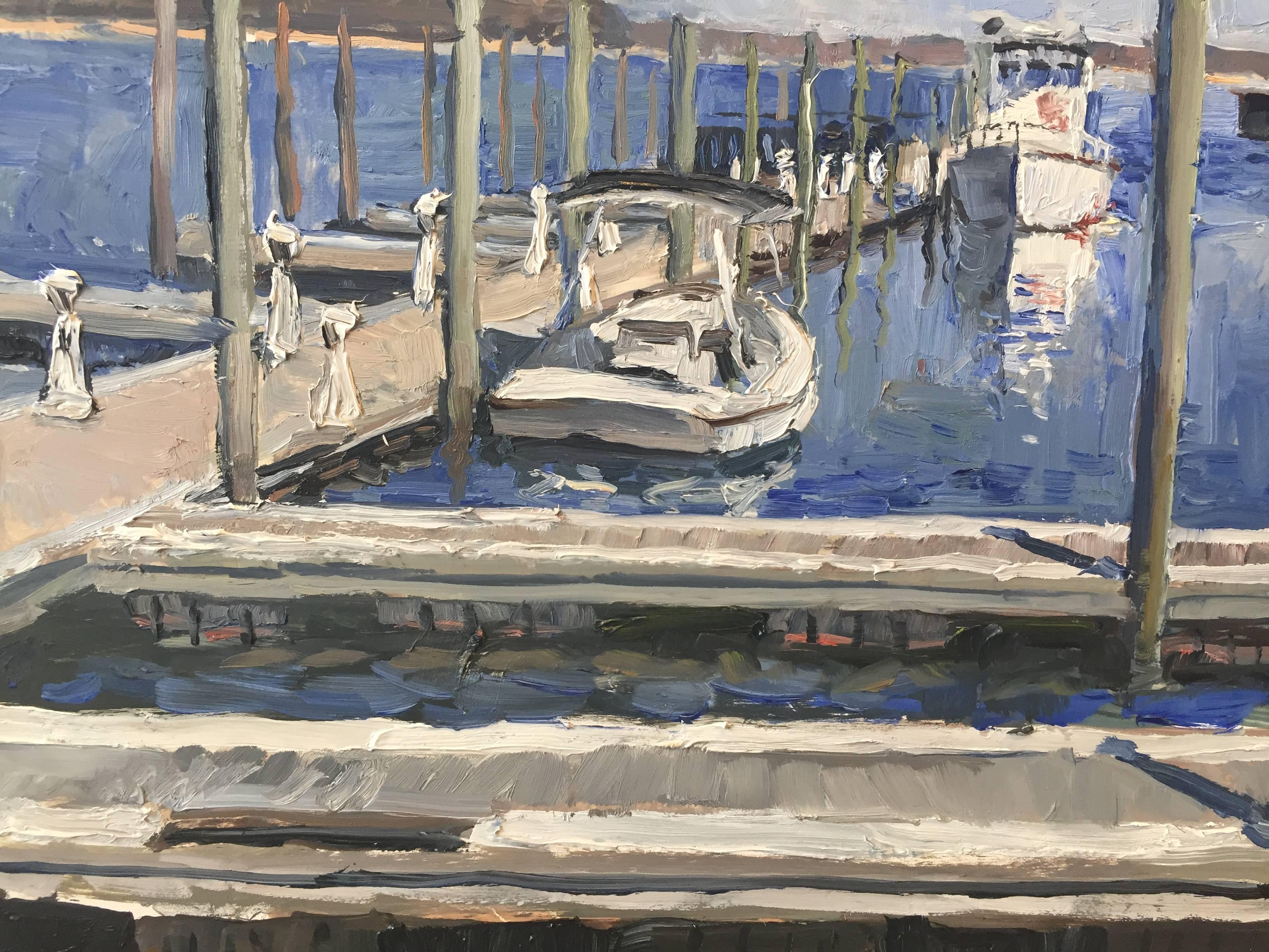Painted from life, on Long Wharf in the village of Sag Harbor. Personett painted the near-empty marina which, in summer, is filled with boats. Cars are parked along the diagonal of the Wharf, looking at the sea. A classical painting style, with a
