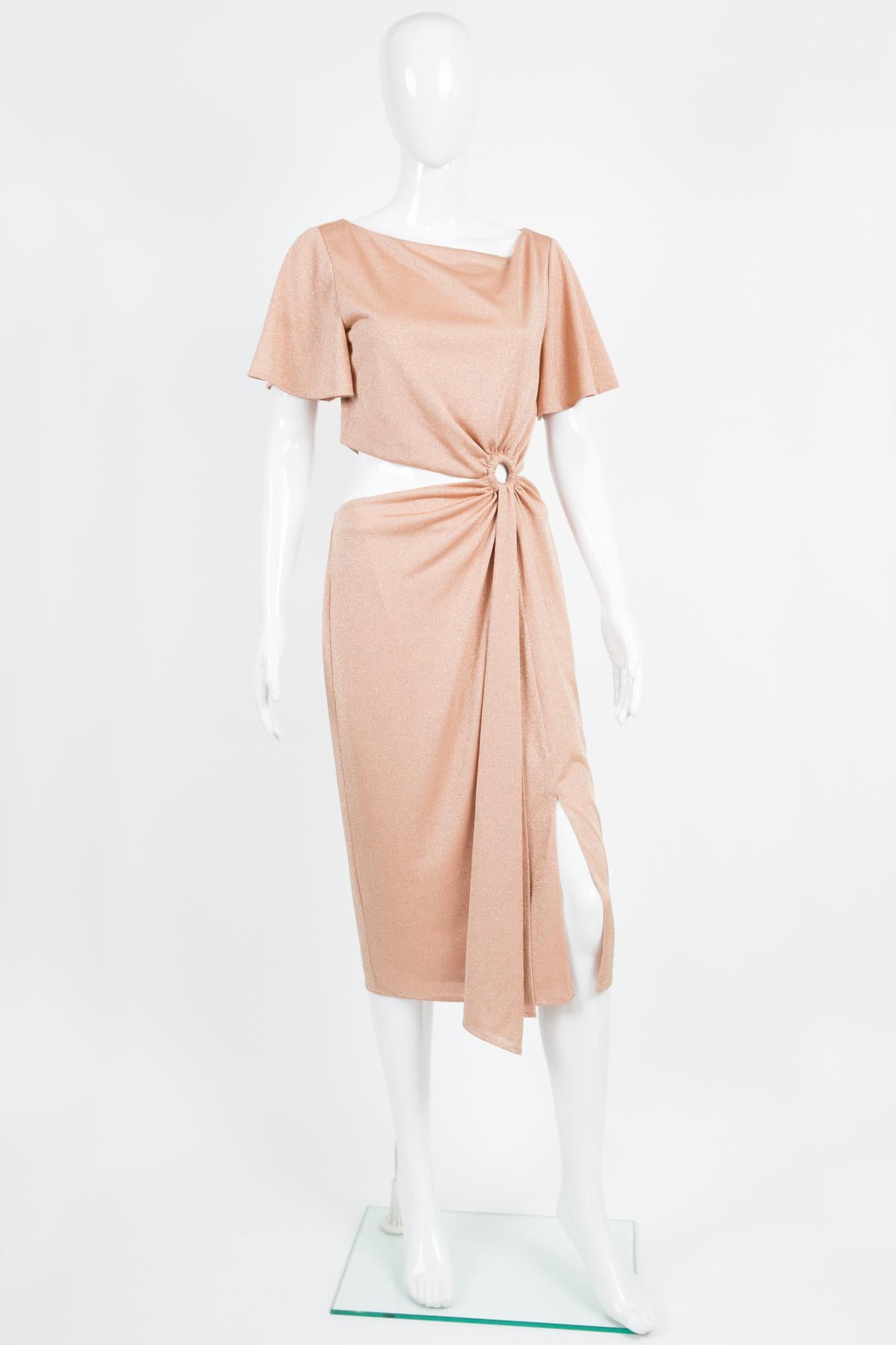 Rachel Zoe pink blush lurex cocktail dress featuring a fluid jersey fabric, a mid length, an asymmetric front ring with sides opens, a front slit, a center back zip opening, dress fully silk jersey lined.
Estimated size 36fr/ US4/ UK8
We guarantee