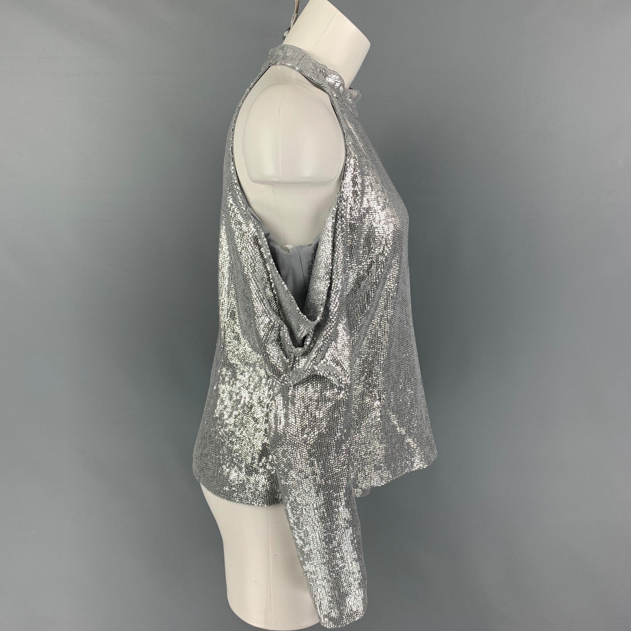 RACHEL ZOE dress top comes in a silver sequined rayon featuring a off-shoulder style, long sleeves, and a back hook & loop closure.
Very Good
Pre-Owned Condition. 

Marked:   8 

Measurements: 
  Bust: 34 inches  Sleeve: 17.5 inches  Length: 22.5