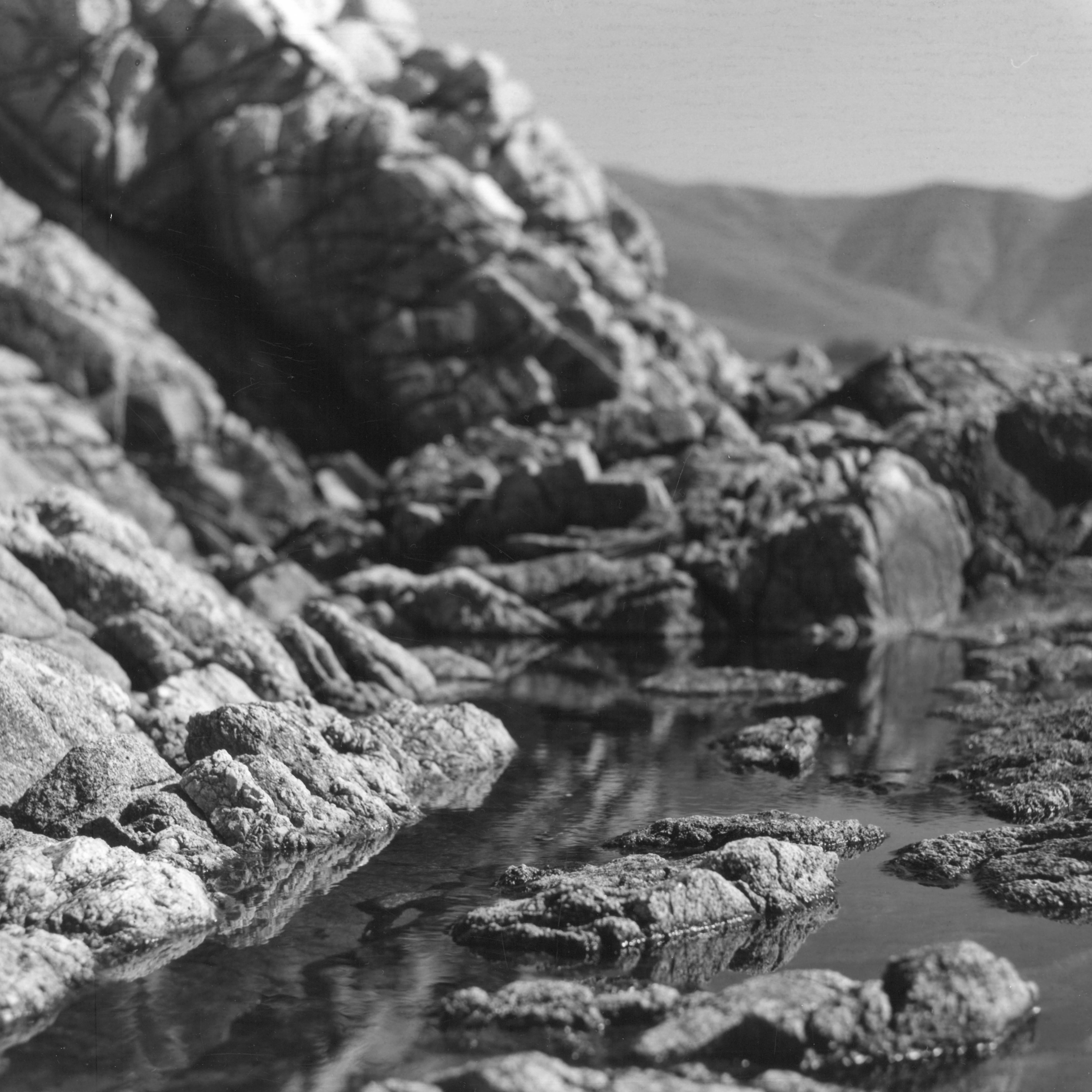 Rachell Hester Landscape Photograph - "Along the Way" a intimate photo of rocks next to a tide pool