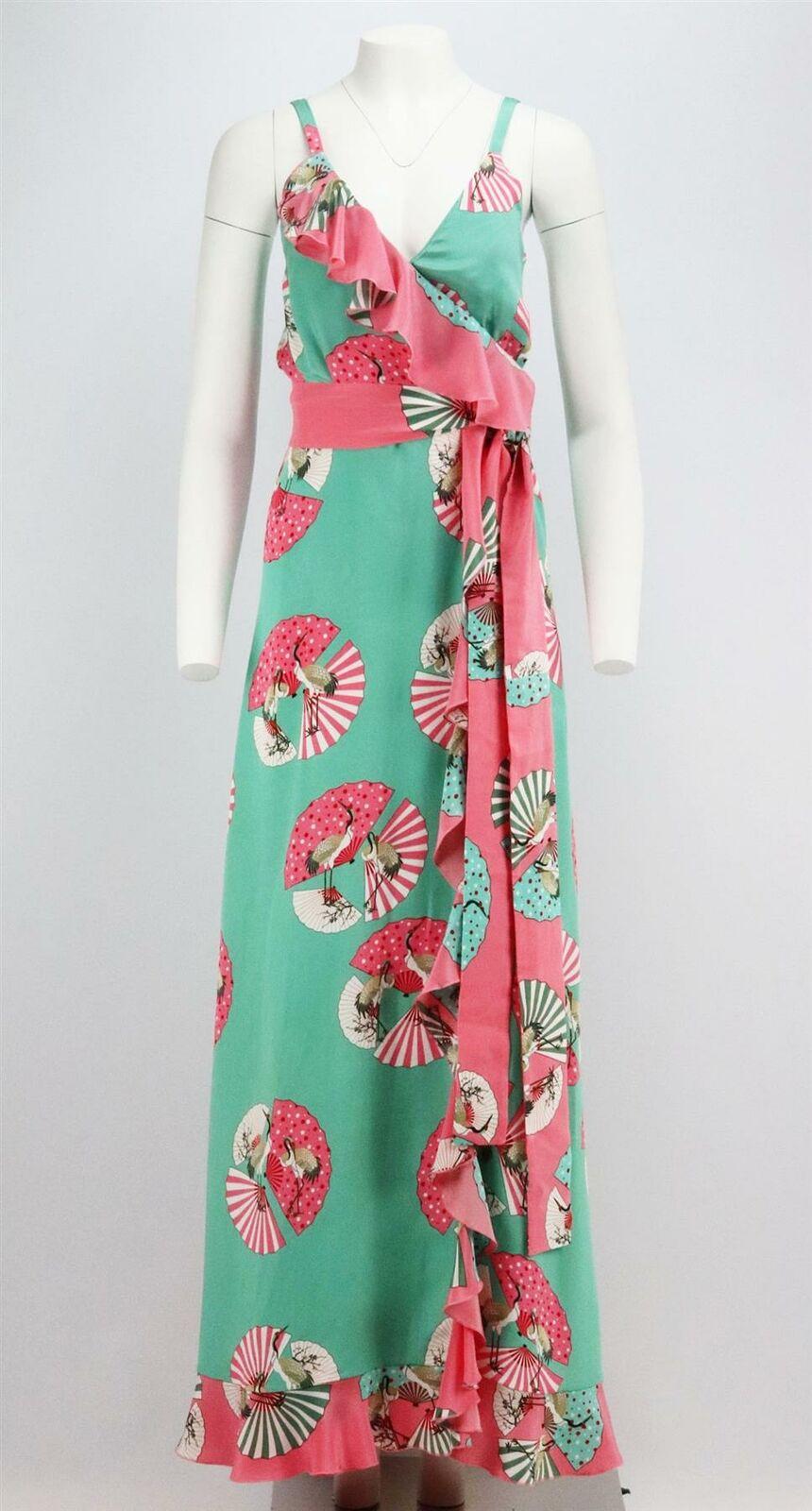 This bohemian maxi dress by Racil is cut from floaty silk crepe de chine decorated with whimsical fans, the flouncy ruffles swish and sway so beautifully in a belted wrap silhouette.
Green, white and pink silk crepe-de-chine.
Belt fastening at