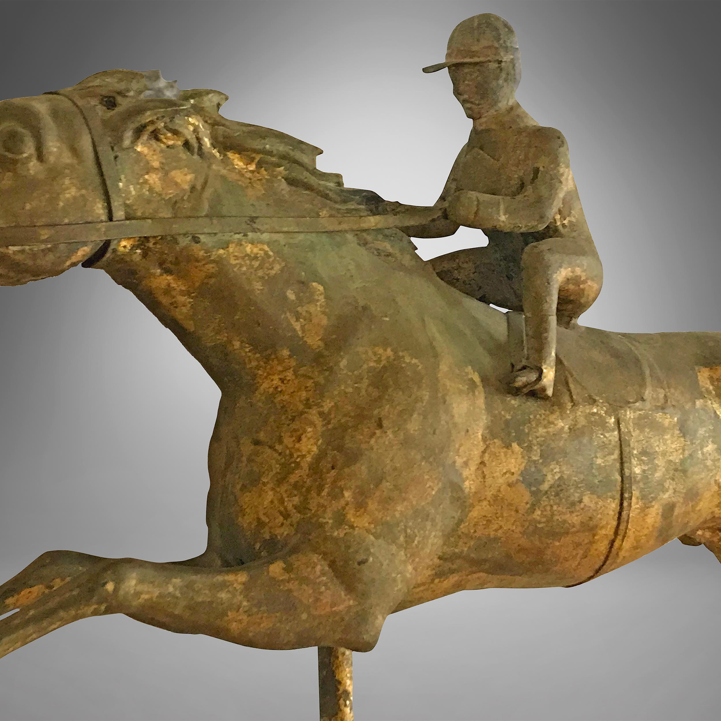 Molded copper and zinc weathervane with gilding. The surface is untouched showing great warm patina. This style of racing horse was named 'Kentucky and Jockey' weathervane in the J.W. Fiske Company catalog
Attributed to the J.W.Fiske Company, circa