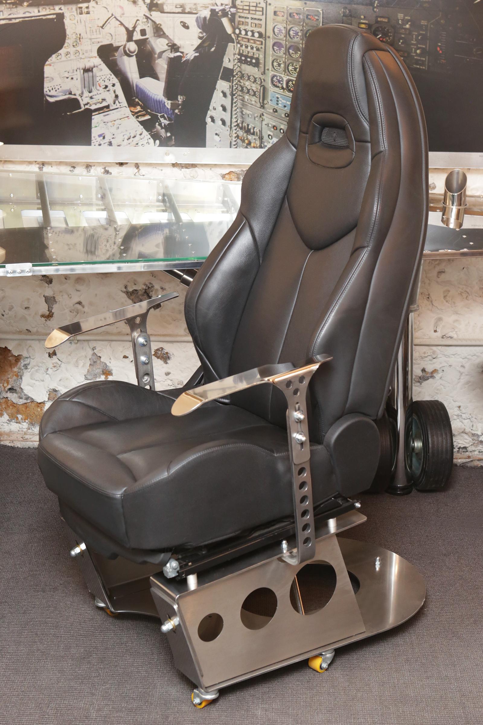 Armchair racing pilot desk office armchair made from a black electric
leather seat of 308 CC coupe cabriolet, mounted on a frame in polished
solid stainless steel. The electric seat adjustments allow you to customize
the seat. The aviation