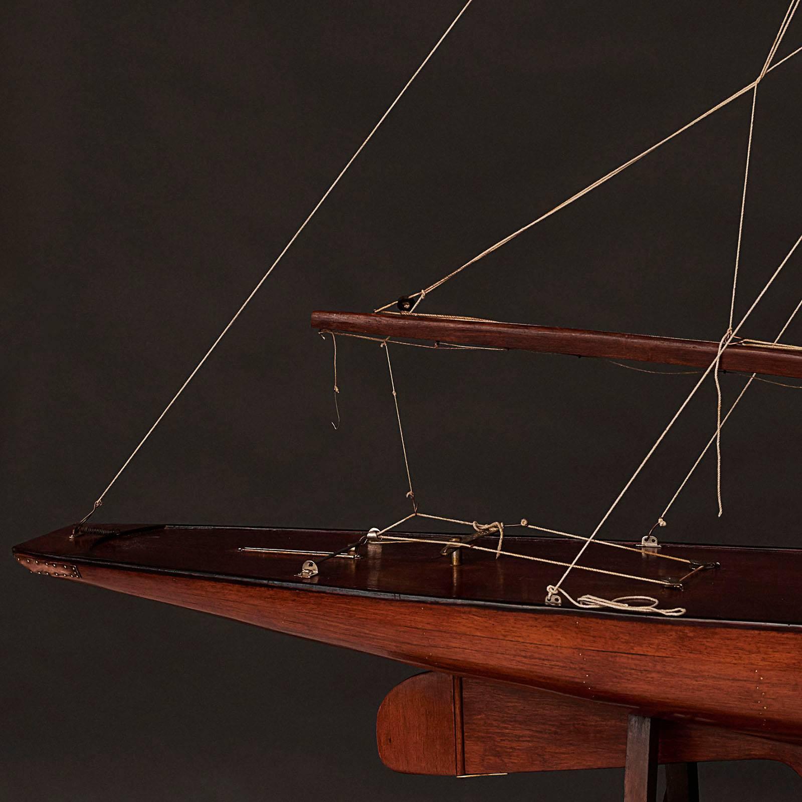 Elegantly designed model ship of a Racing Yacht. Made in mahogany. Denmark, circa 1930.