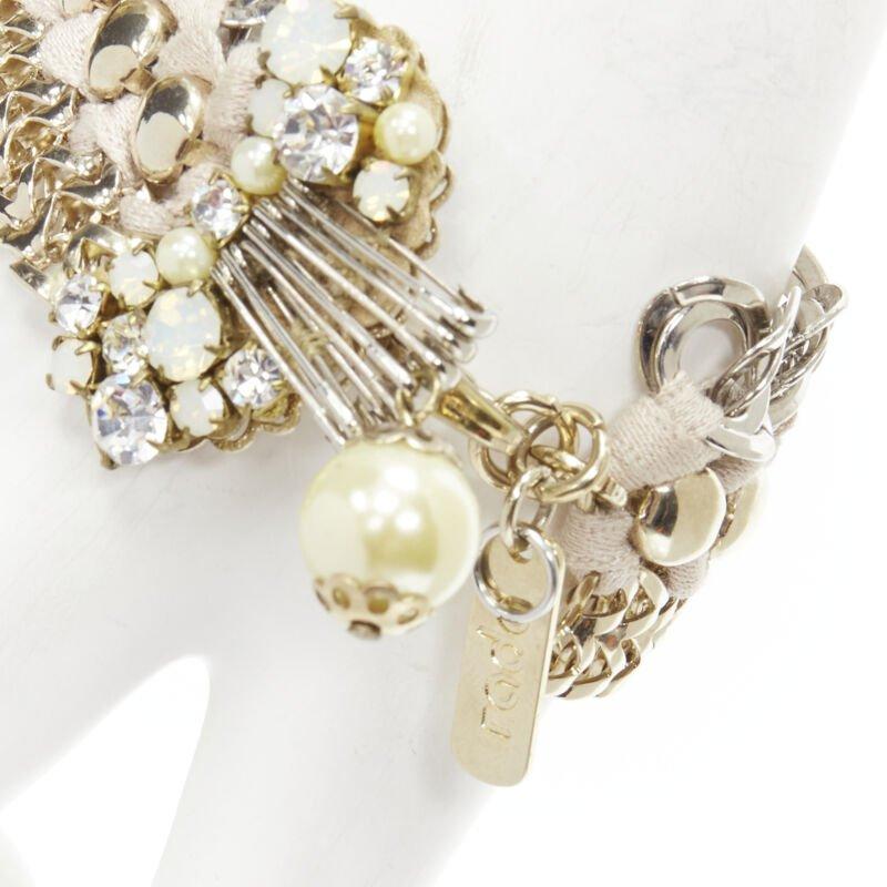 RADA mixed gold silver braided crystal rhinestones pearl charm bracelet
Reference: ANWU/A00276
Brand: Rada
Material: Metal, Fabric
Color: Silver, Gold
Pattern: Solid
Closure: Lobster Clasp

CONDITION:
Condition: Excellent, this item was pre-owned