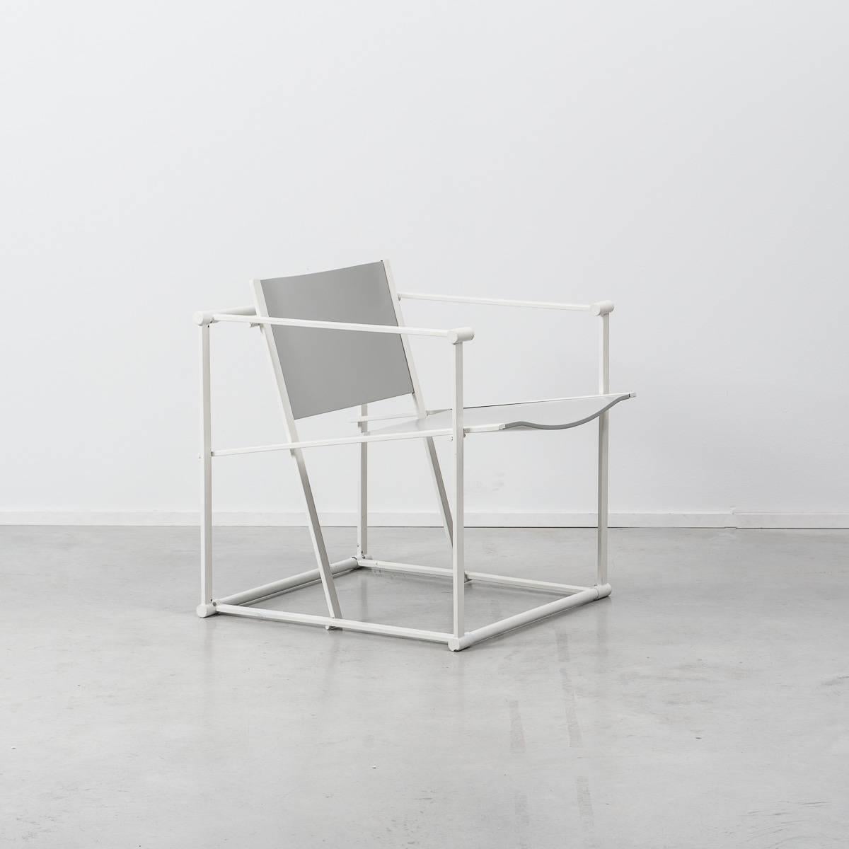 This FM60 chair was designed by Radboud Van Beekum and manufactured by UMS Pastoe. It has a white folded metal frame with grey plywood seating. Following in the tradition of the De Stijl movement, the FM60 series is inspired by the designs of Gerrit