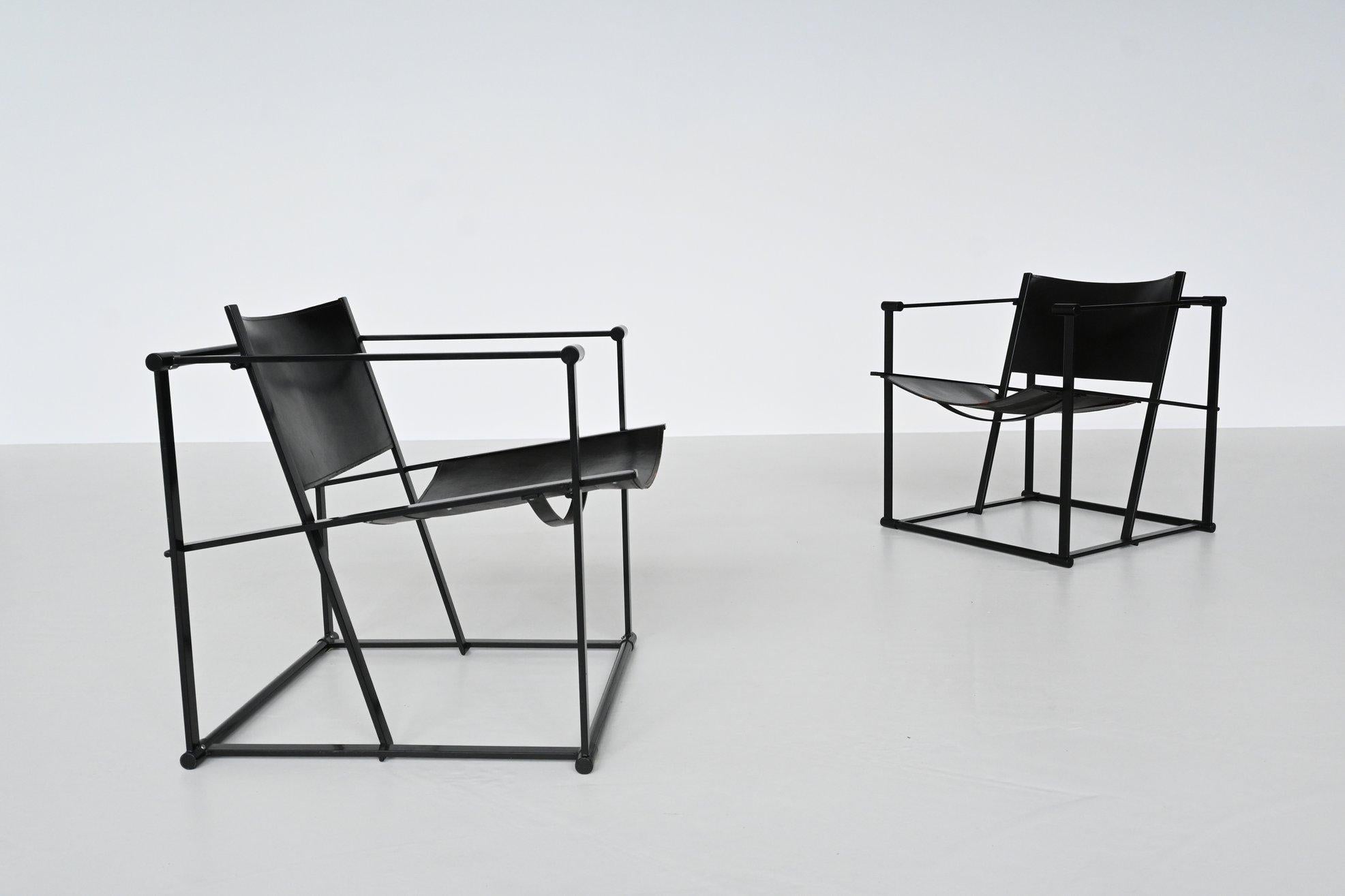 Beautiful minimalistic pair of cubic lounge chairs model FM61 designed by Radboud Van Beekum and manufactured by Pastoe, The Netherlands 1980. These very nice geometrical shaped chairs have a black coated metal structure and black thick saddle