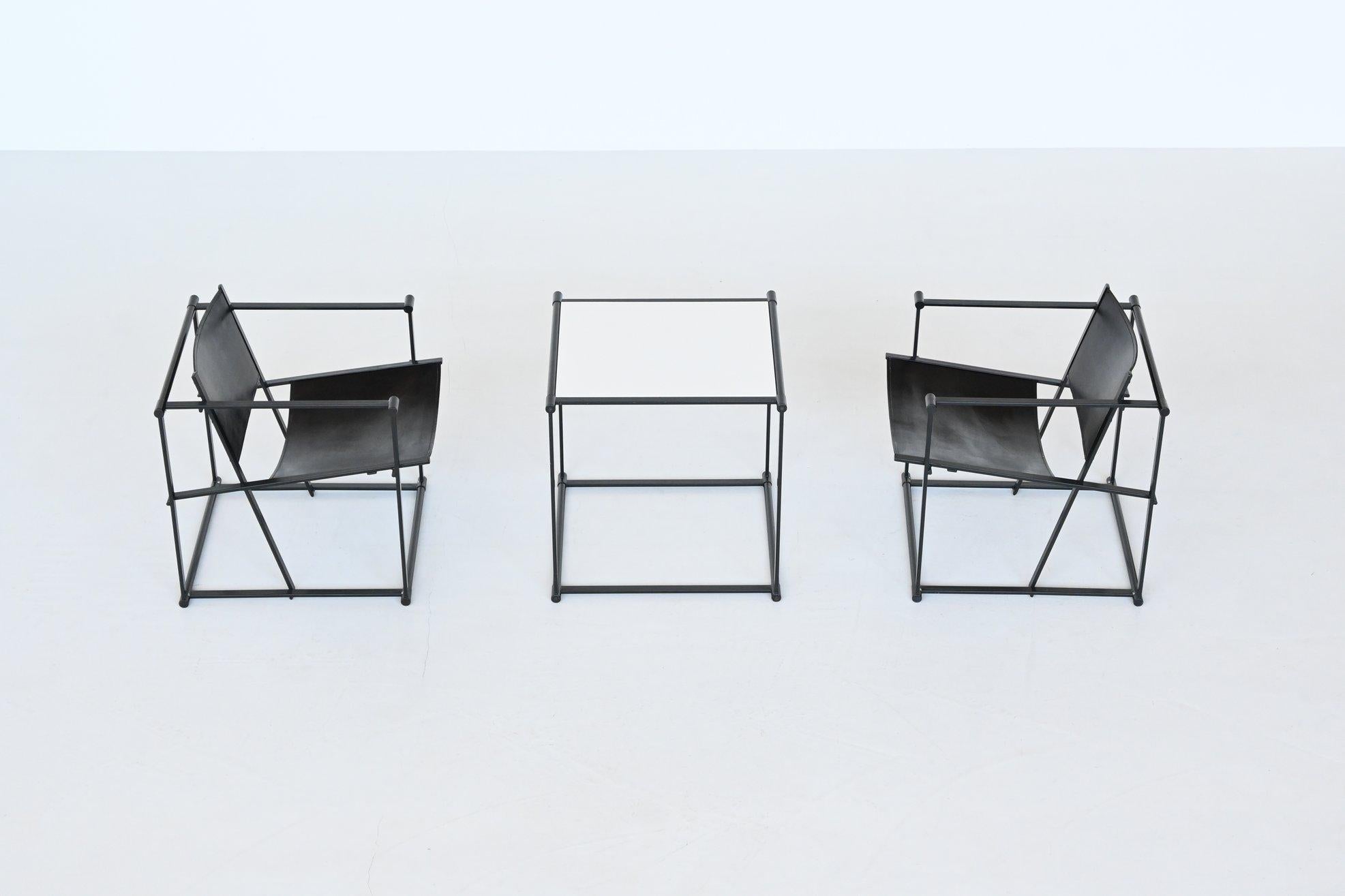 Beautiful minimalistic pair of cubic lounge chairs and table model FM61 designed by Radboud van Beekum and manufactured by Pastoe, The Netherlands 1980. These very nice geometrical shaped chairs and table have a black coated metal structure and