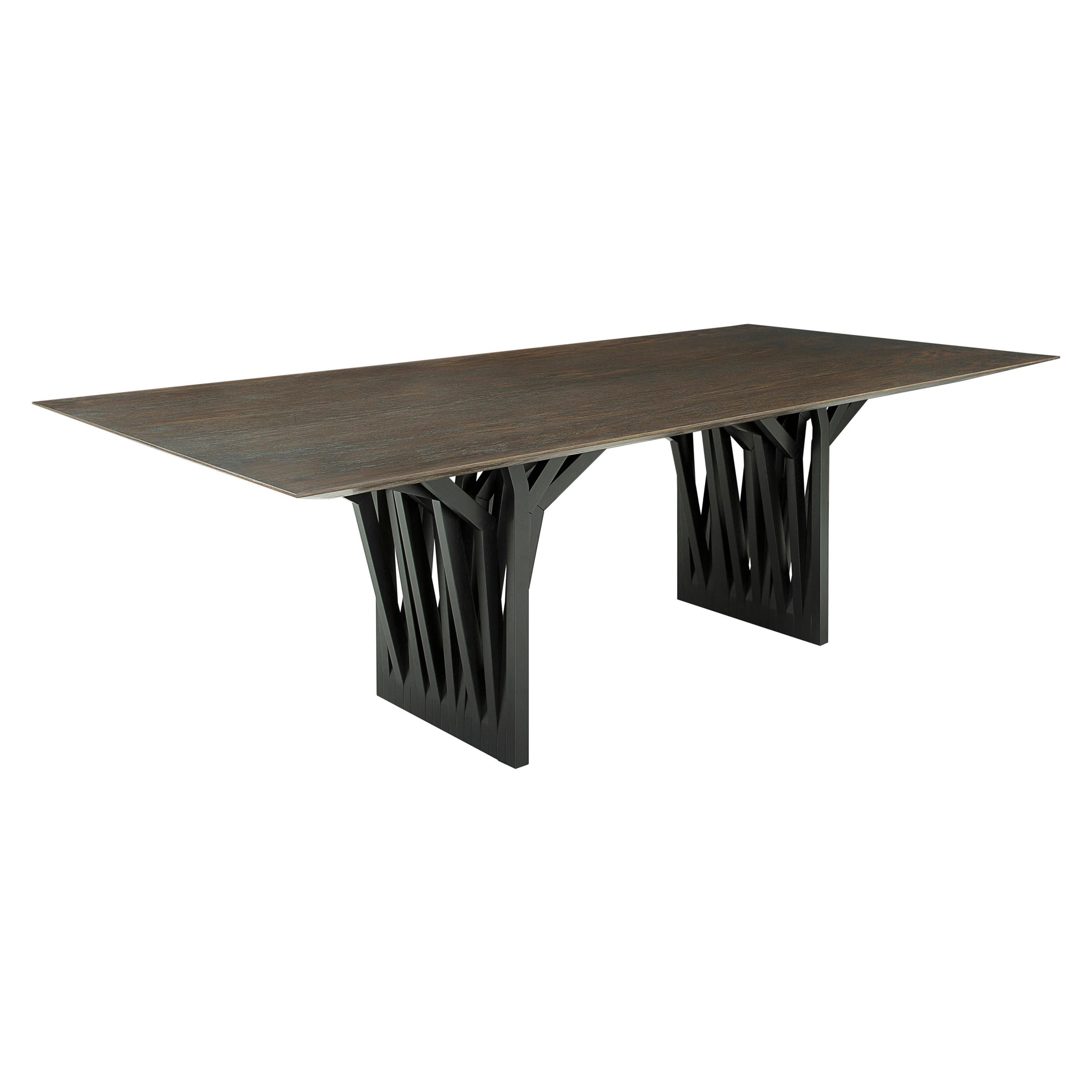 The Radi dining table is this masterpiece in a dark walnut finish wood veneer top and an original black roofing anchor table base, inspired by the aerial roots of trees. This dining table is a very simple piece that the Uultis team has created with