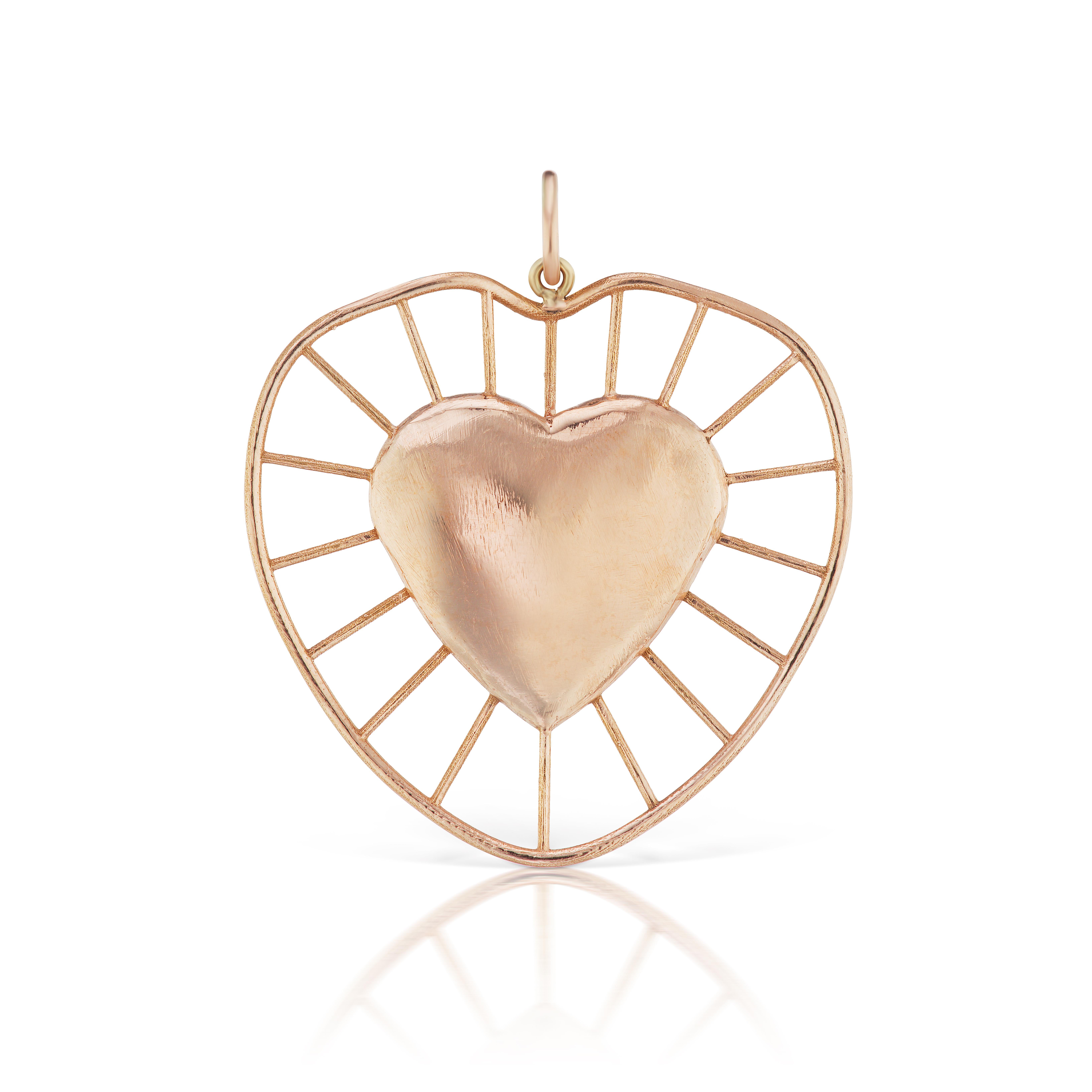 The Radial heart charm is designed by Christina Alexiou. 
This modern beautiful charm is crafted with 18k yellow gold and made in Greece.  
The heart is hollow, thus makes it a light-weight everyday piece of jewelry. 
It is available in two colours,