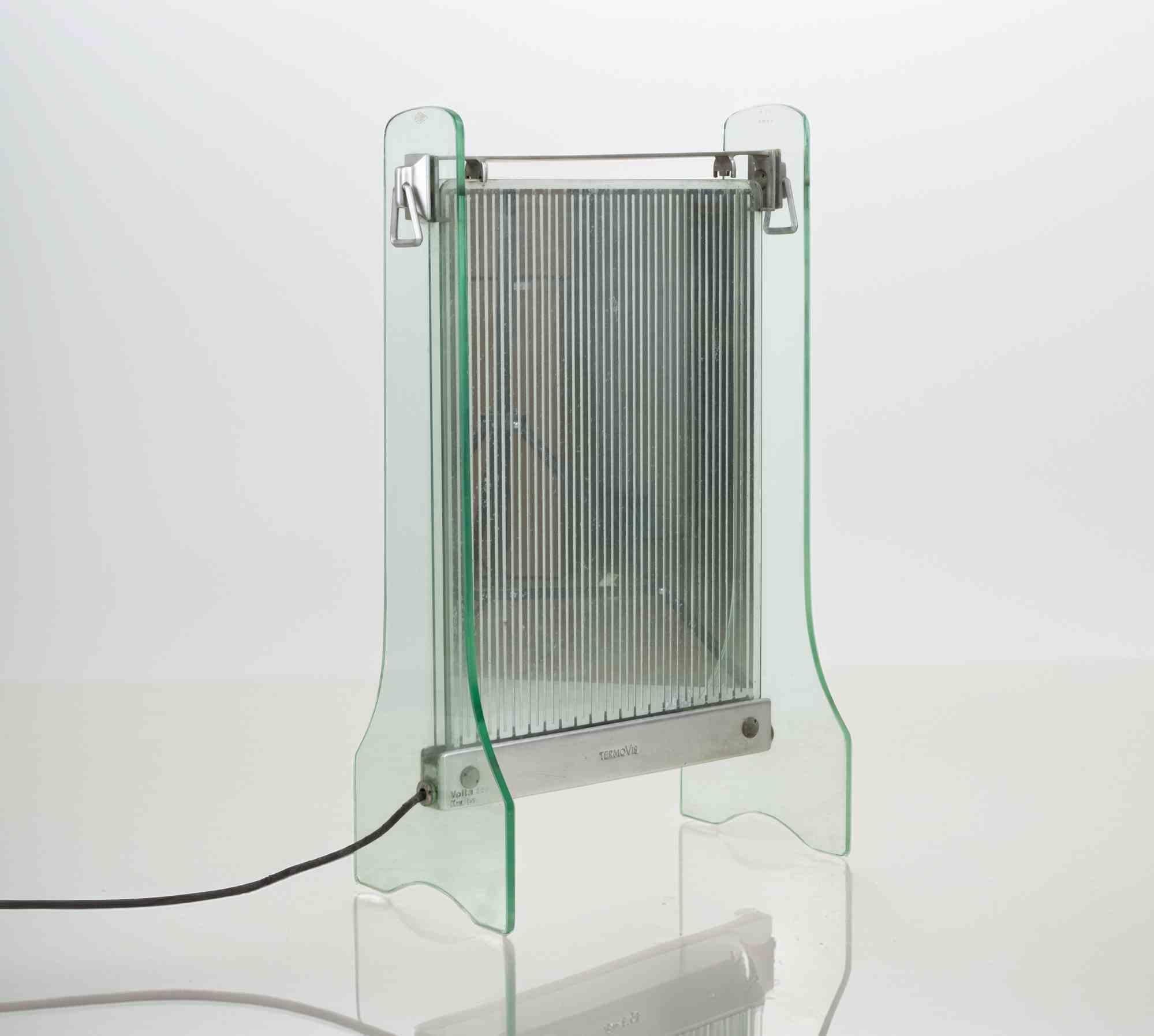 TermoVis, Espagne. Chauffage radiant, années 1930.

Verre de sécurité, verre, métal, fonte d'aluminium. 

Marqué : TermoVis Voltra 220 Kw.2.

Très bon état.