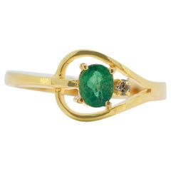 Radiant 0.22ct Oval Green Emerald Ring in 18K Yellow Gold