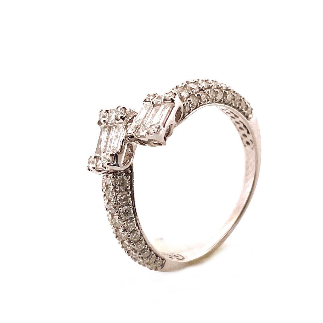 Adorn yourself with the dazzling beauty of this radiant diamond ring. Crafted from 14k white gold and weighing 3.2g, this ring features a stunning 1.15ct diamond at its center, surrounded by a double halo of smaller diamonds. The intricate design