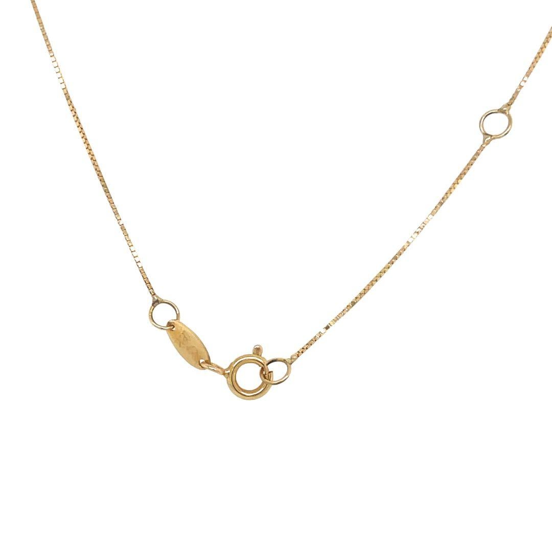 This radiant diamond necklace features a round-cut diamond pendant encircled by a dazzling diamond pave halo, all set in 18-karat yellow gold for a brilliant shine. 

Handcrafted by fine jewelry artisans in Brazil, this fine jewelry piece showcases