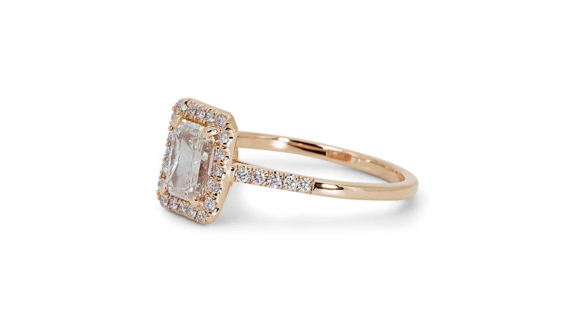 Radiant 18k Yellow Gold Natural Diamond Halo Ring w/1.75 ct - GIA Certified

This captivating diamond halo ring showcases a bold and modern design, featuring a stunning 1.50 carat cut-cornered rectangular diamond center stone, accentuated by 30