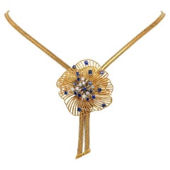 Radiosa collana floreale a stella degli anni '60 con zaffiri e diamanti in oro 18 carati