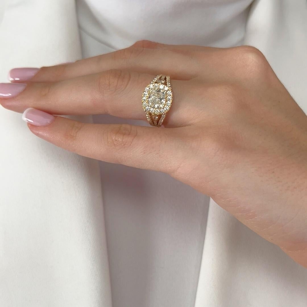 Radiant 2.41ct Diamonds Halo Ring in 18k Yellow Gold - IGI Certified

A true masterpiece of elegance, this 18K yellow gold ring showcases a breathtaking 1.59ct cushion-cut diamond at its center, exuding exceptional brilliance. Surrounding it, 52