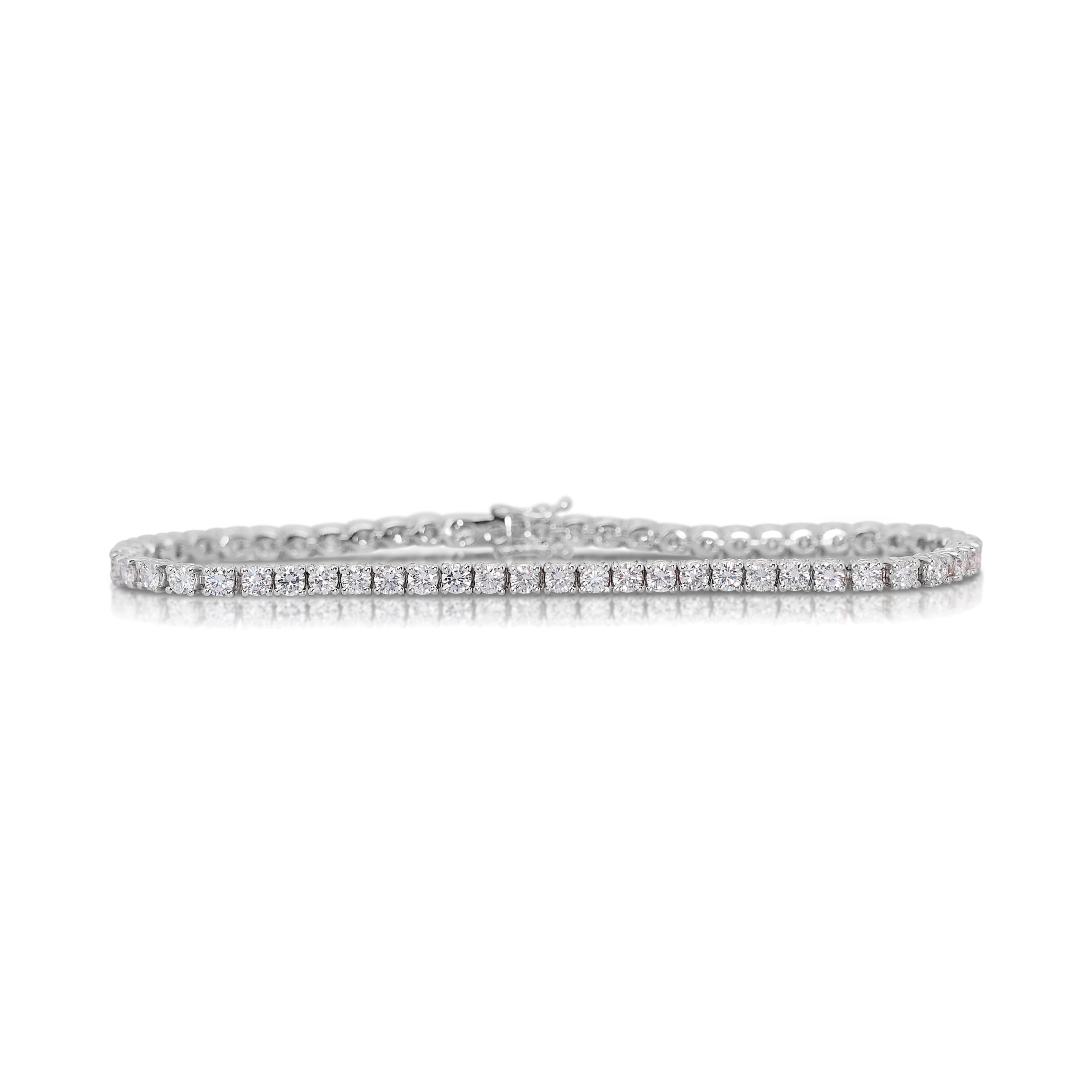 Radiant 5.32ct Diamonds Tennis Bracelet in 14k White Gold - IGI Certified

Introducing this elegant tennis bracelet, a masterpiece designed to dazzle and delight. This luxurious accessory showcases 56 brilliant round diamonds, collectively weighing