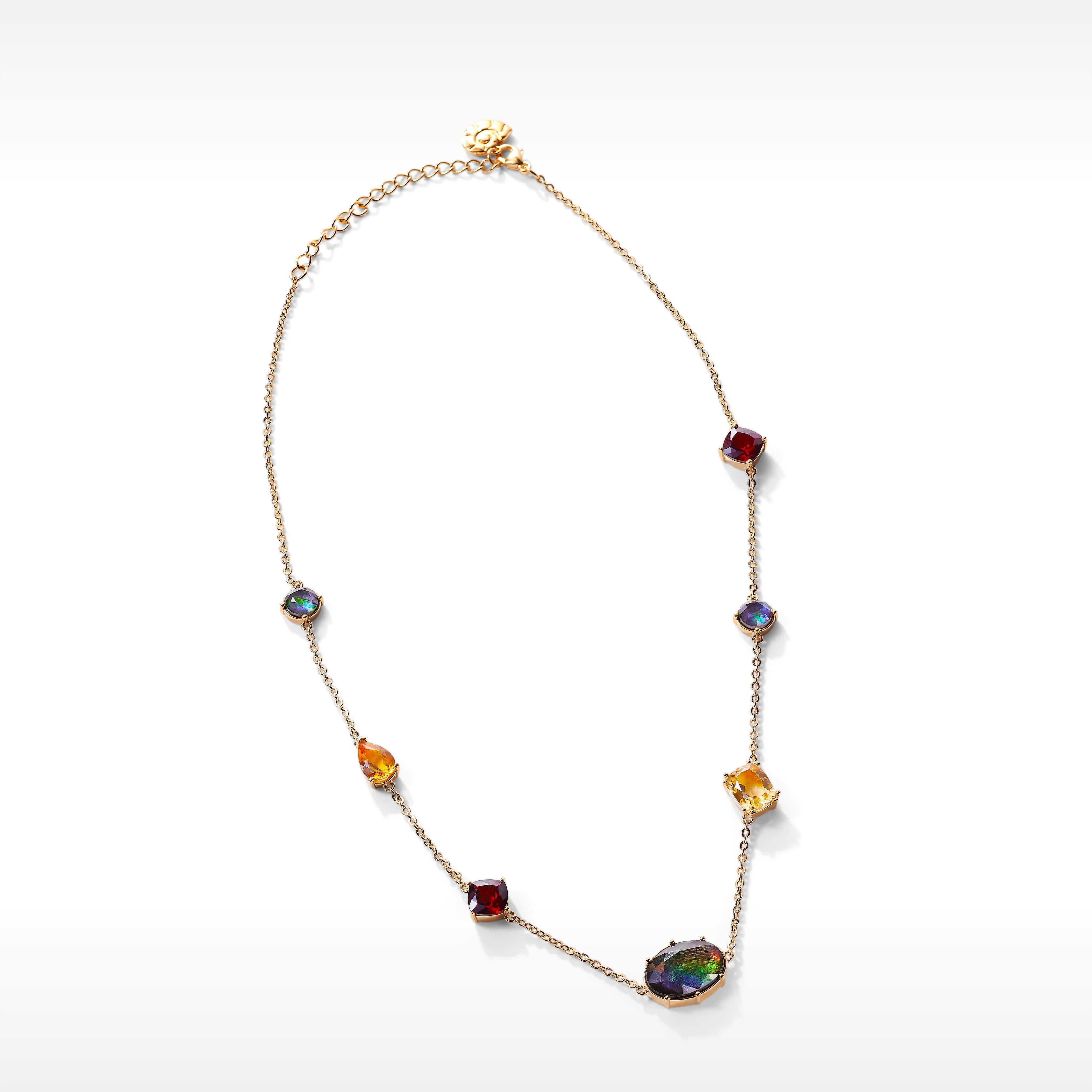 Product Details:
The Radiant collection features striking ammolite clustered with citrine, garnet and white topaz in a celebration of festive gathering seasons.

AA grade Ammolite
10mm x 14mm oval and 6mm round (2) Ammolite station necklace
18K gold