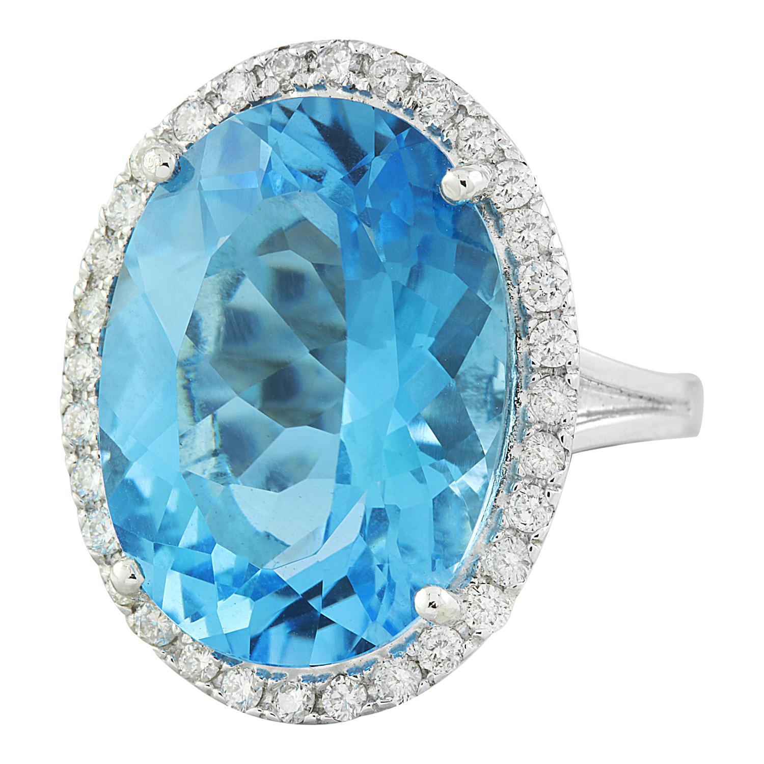 Introducing our magnificent 14 Karat Solid White Gold Diamond Ring featuring a stunning 20.50 Carat Natural Topaz centerpiece, stamped for authenticity. Crafted with precision and elegance, this ring is a true statement of luxury. Weighing 9.5