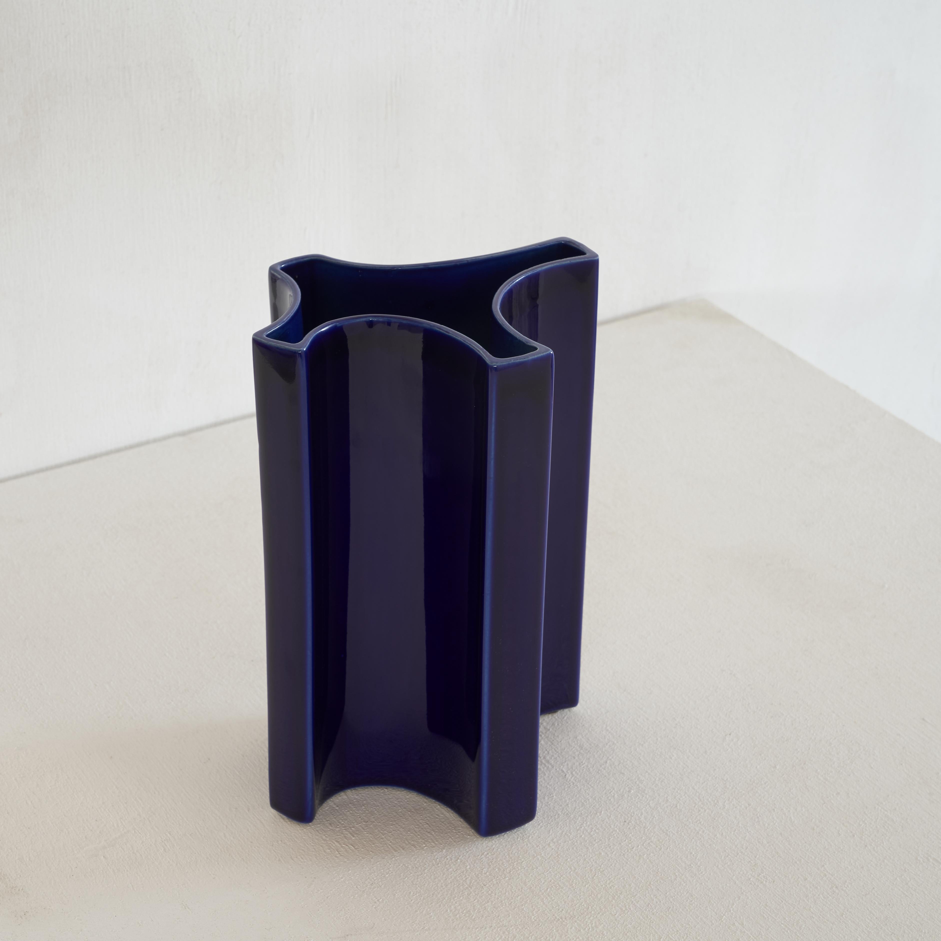 Fantastic freeform vase by Angelo Mangiarotti (1921 – 2012) in a great blue color for Fratelli Brambilla Milano.

Mangiarotti was a multi talented man and one of the great designers of the 20th century. He is known for his marble tables and