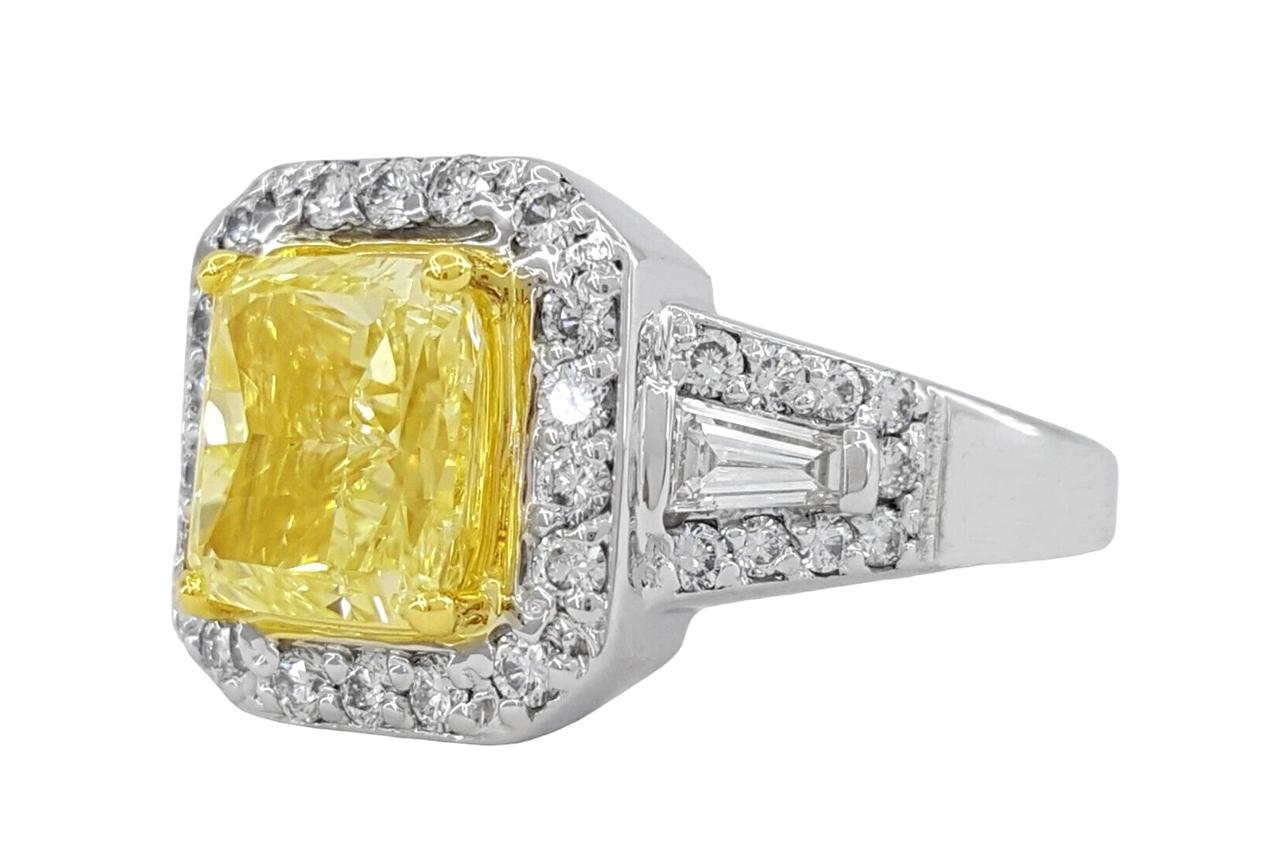 Radiant Brilliant Cut Natural Light Yellow Diamond Halo Engagement Ring in 14K White & 18K Yellow Gold.



The ring weighs 8.6 grams, size 6.25. The center stone is a Natural Radiant Brilliant Cut Diamond weighing 2.28 ct, W-X fancy light yellow in
