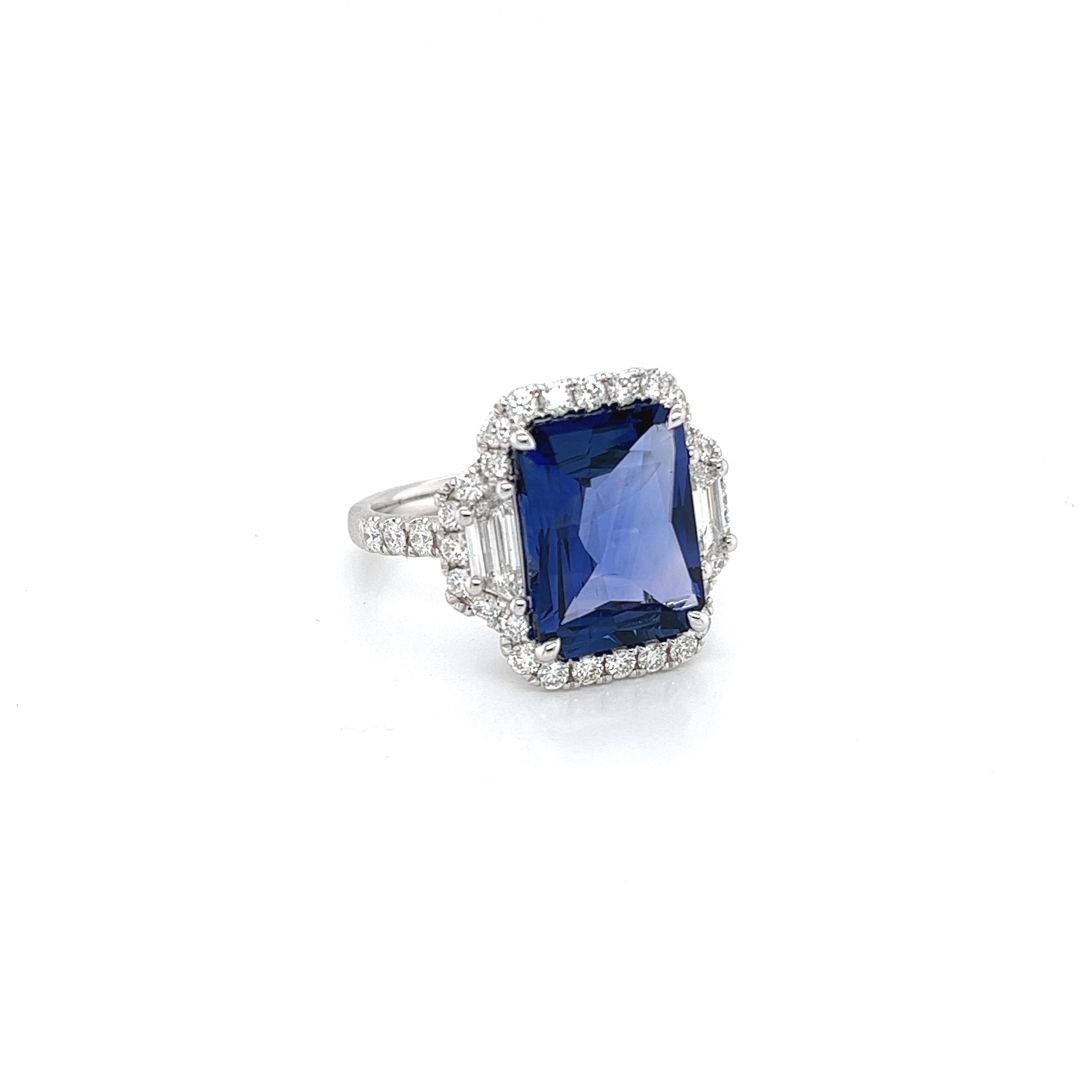 Radiant Ceylon sapphire weighing 5.81 cts
Measuring (12.7x9.7x4.6) mm
Round Diamonds weighing .72 cts
Trapezoid Diamonds weighing .43 cts
Set in 18k white gold ring
5.61 g