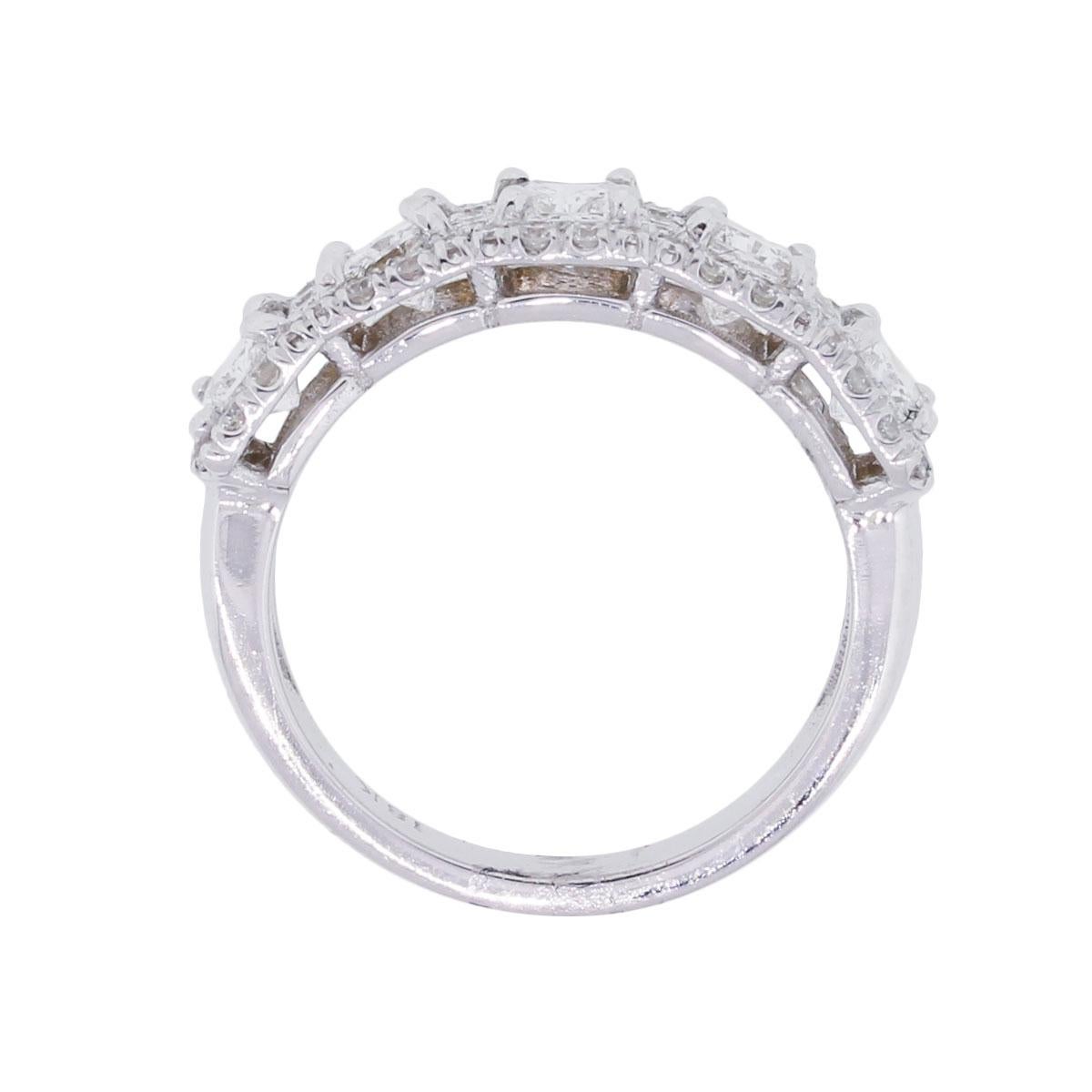 Material: 18k white gold
Diamond Details: Approximately 1.65ctw of radiant cut diamonds and 0.70ctw of round brilliant diamonds. Diamonds are G/H in color and VS in clarity
Ring Size: 6 (can be sized)
Ring Measurements: 0.86″ x 0.28″ x 0.86″
Total