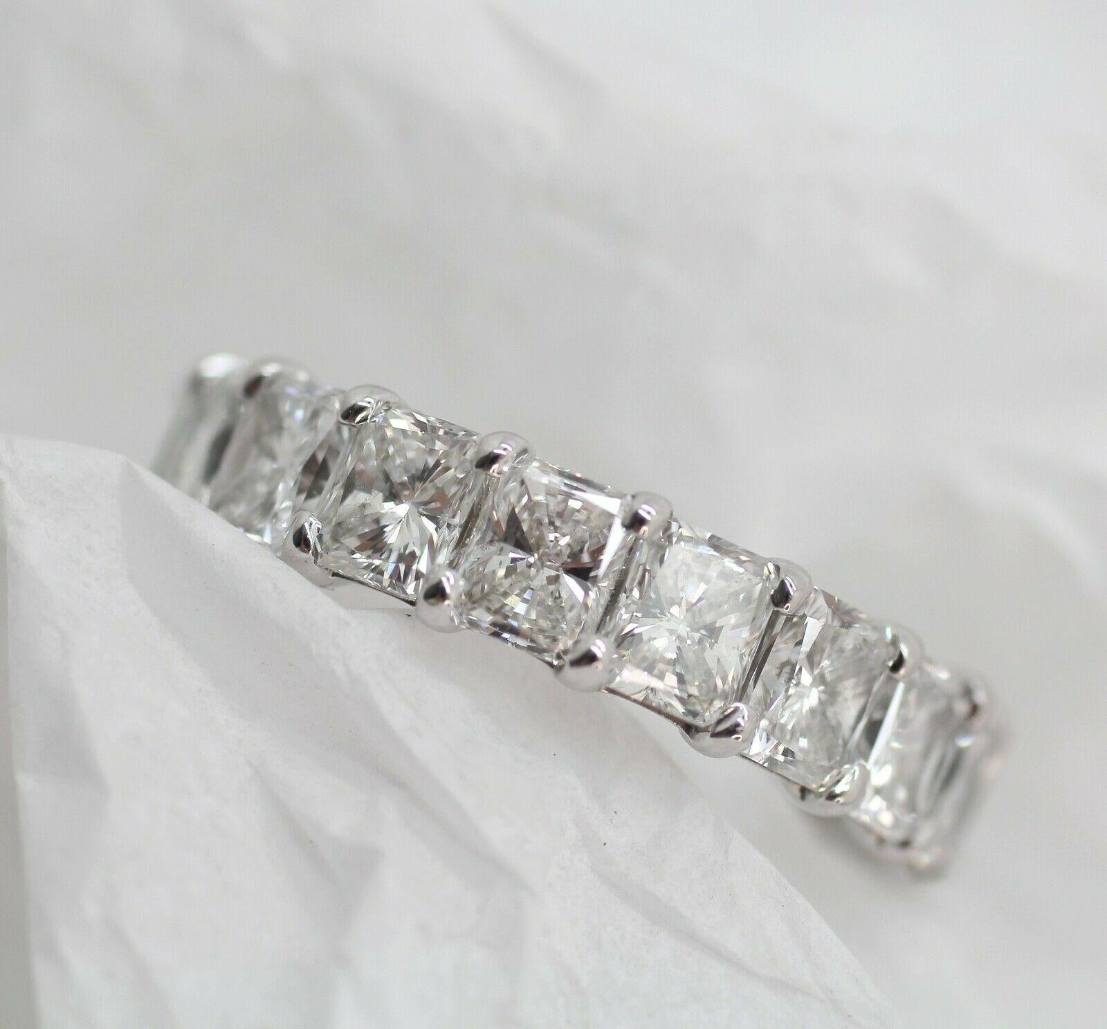 Specifications:
    main stone:RADIANT CUT DIAMOND
    DIAMONDS:18 PCS
    carat total weight:5.67 CARAT TOTAL WEIGHT
    color:G
    clarity:SI1
    brand:NONE
    metal:14K WHITE GOLD
    type:ETERNITY ring
    weight: 3.91 GrS
    size:6.25 US

