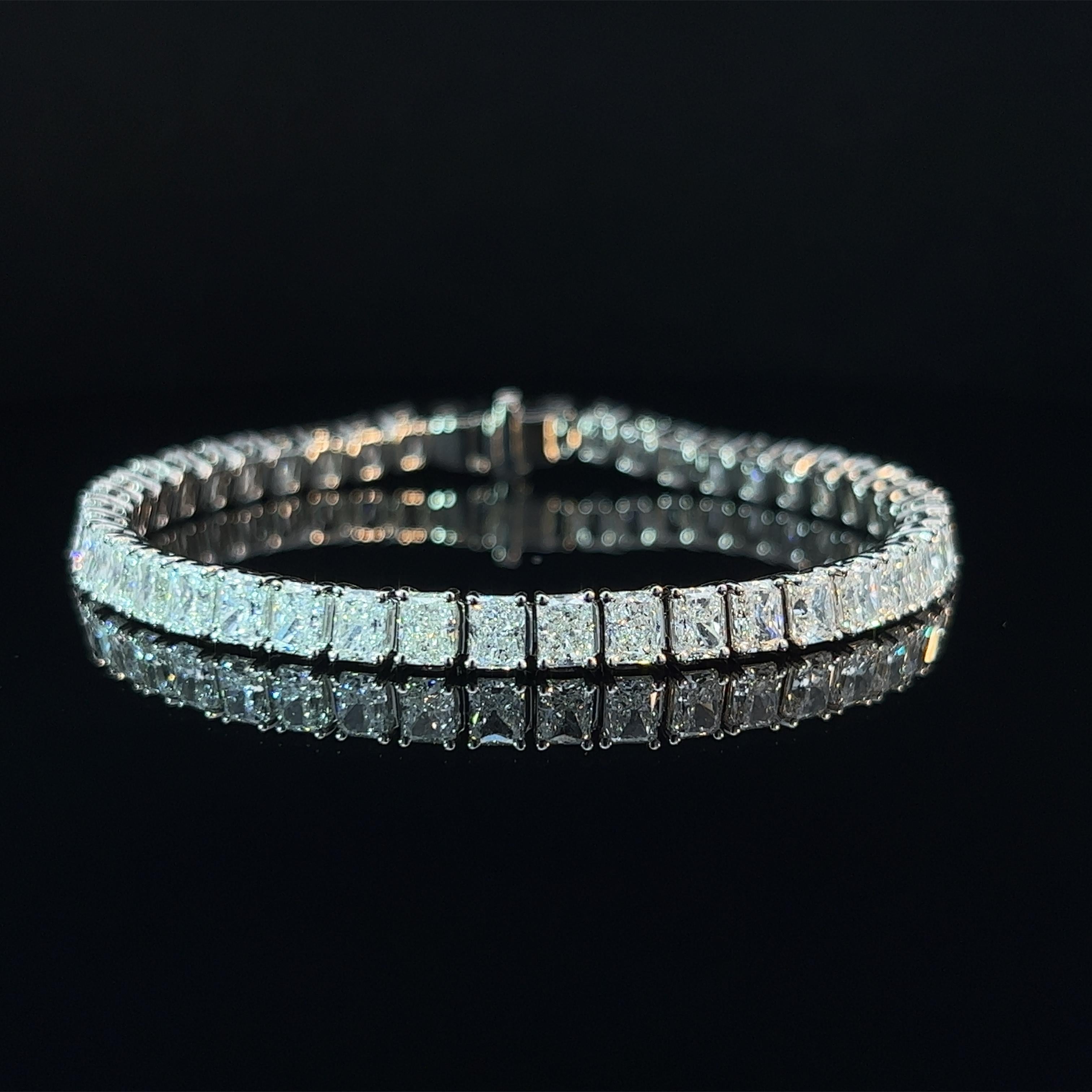 Diamond Shape: Radiant 
Total Diamond Weight: 13.92ct
Individual Diamond Weight: .33ct 
Color/Clarity: FG VVS  
Metal: Platinum
Metal Weight: 21.17g

Key Features:

Radiant-Cut Diamonds: The focal point of this bracelet consists of a series of
