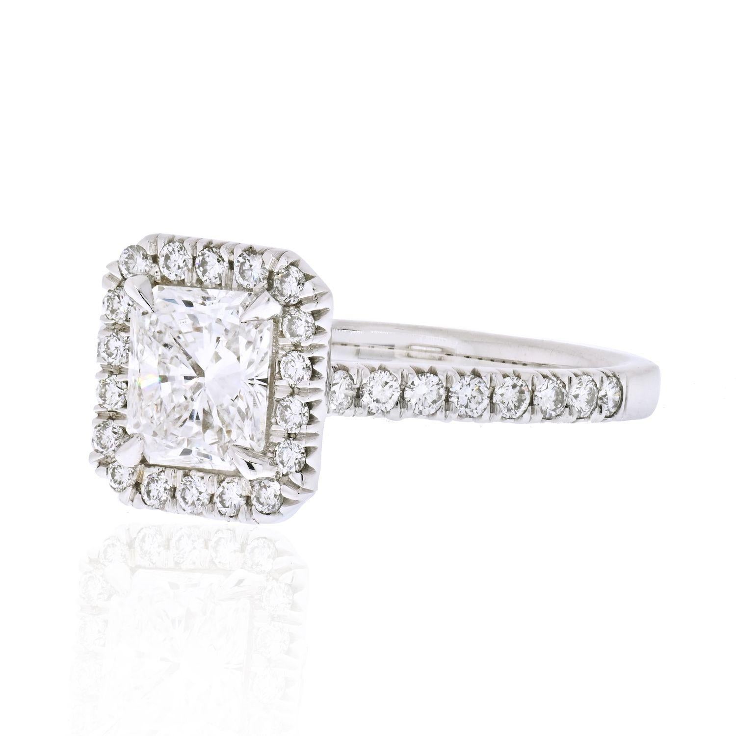 Halo set diamond engagement rings have always been in style. People say it's just a fad but we say it's a style that is here to stay. There are a few things that this ring has going for it: center diamond is a full carat, it is of a colorless grade,