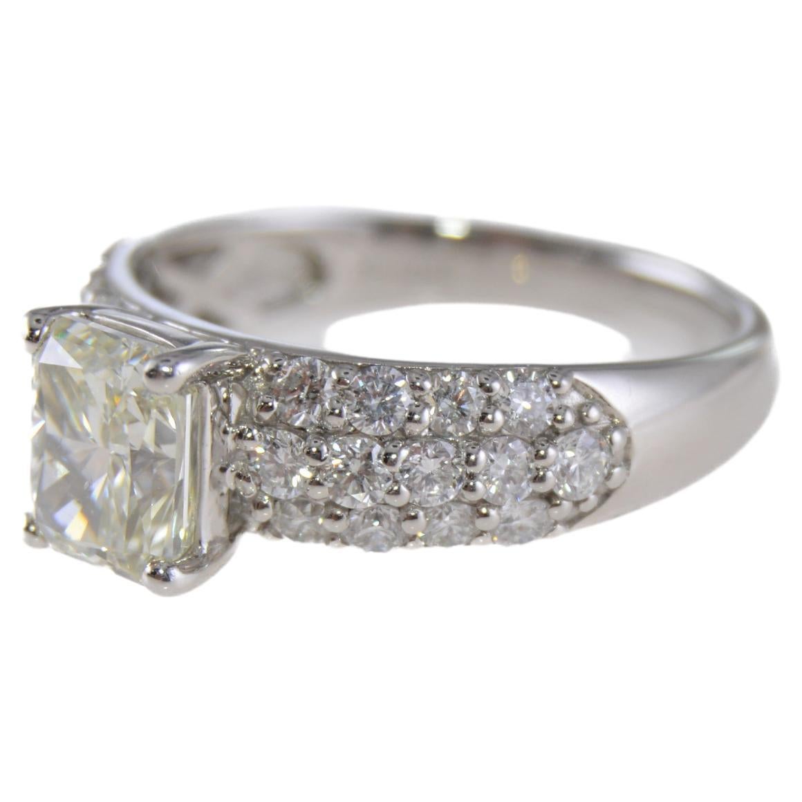 STYLE / REFERENCE: Art Deco 
METAL / MATERIAL: Platinum
CIRCA / YEAR: Estate 
ACCENT STONES / WEIGHT: 
SIZE: 6 1/4


Hand constructed in Platinum, this beautiful engagement ring featured a 1.51ct Radiant cut diamond and several rows of pave set