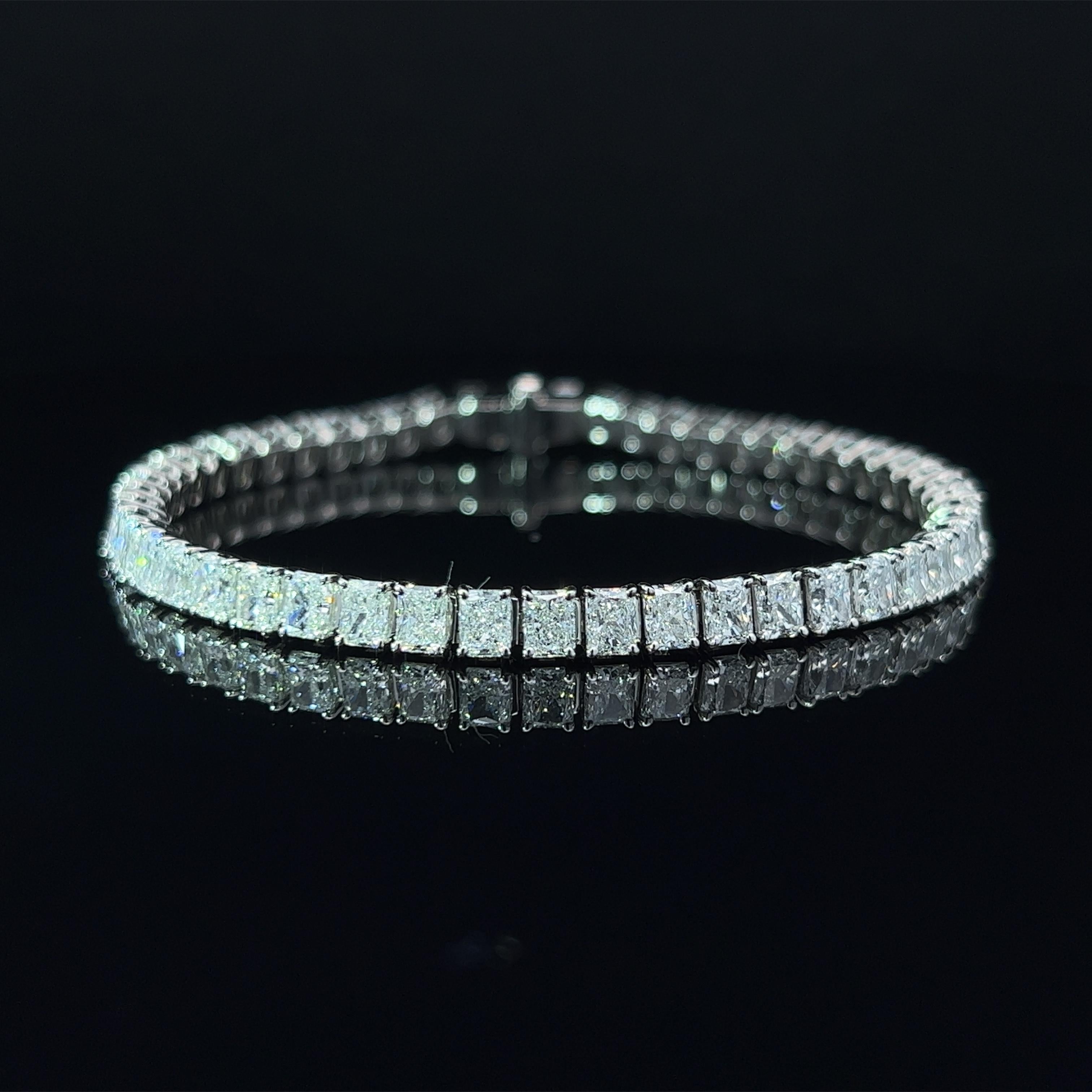 Diamond Shape: Radiant Cut 
Total Diamond Weight: 12.09ct
Individual Diamond Weight: .25ct
Color/Clarity: GH VVS  
Metal: 950 Platinum 
Metal Weight: 19.70g 

Key Features:

Radiant-Cut Diamonds: The centerpiece of this bracelet features a dazzling