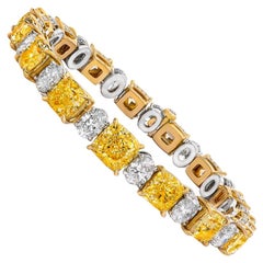 Radiant Cut Fancy Yellow Diamonds and Oval Cut Diamonds 18 Karat White Gold