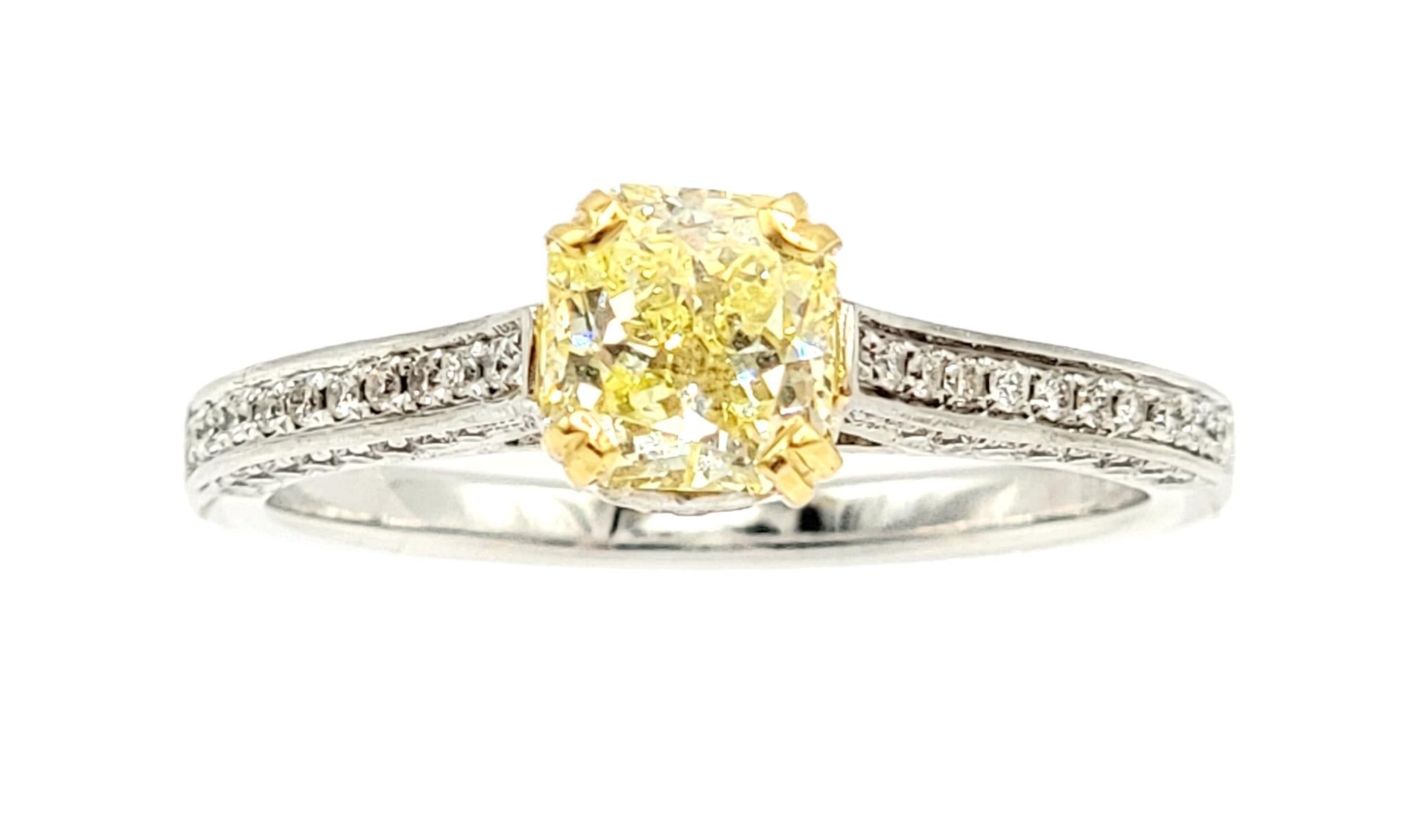 Ring size: 6.5

Gorgeous and unique yellow and white diamond engagement ring design that showcases the color and brilliance of both. The breathtaking ring features a sparkling radiant cut .85 carat Fancy Intense Yellow diamond 4 prong set at the