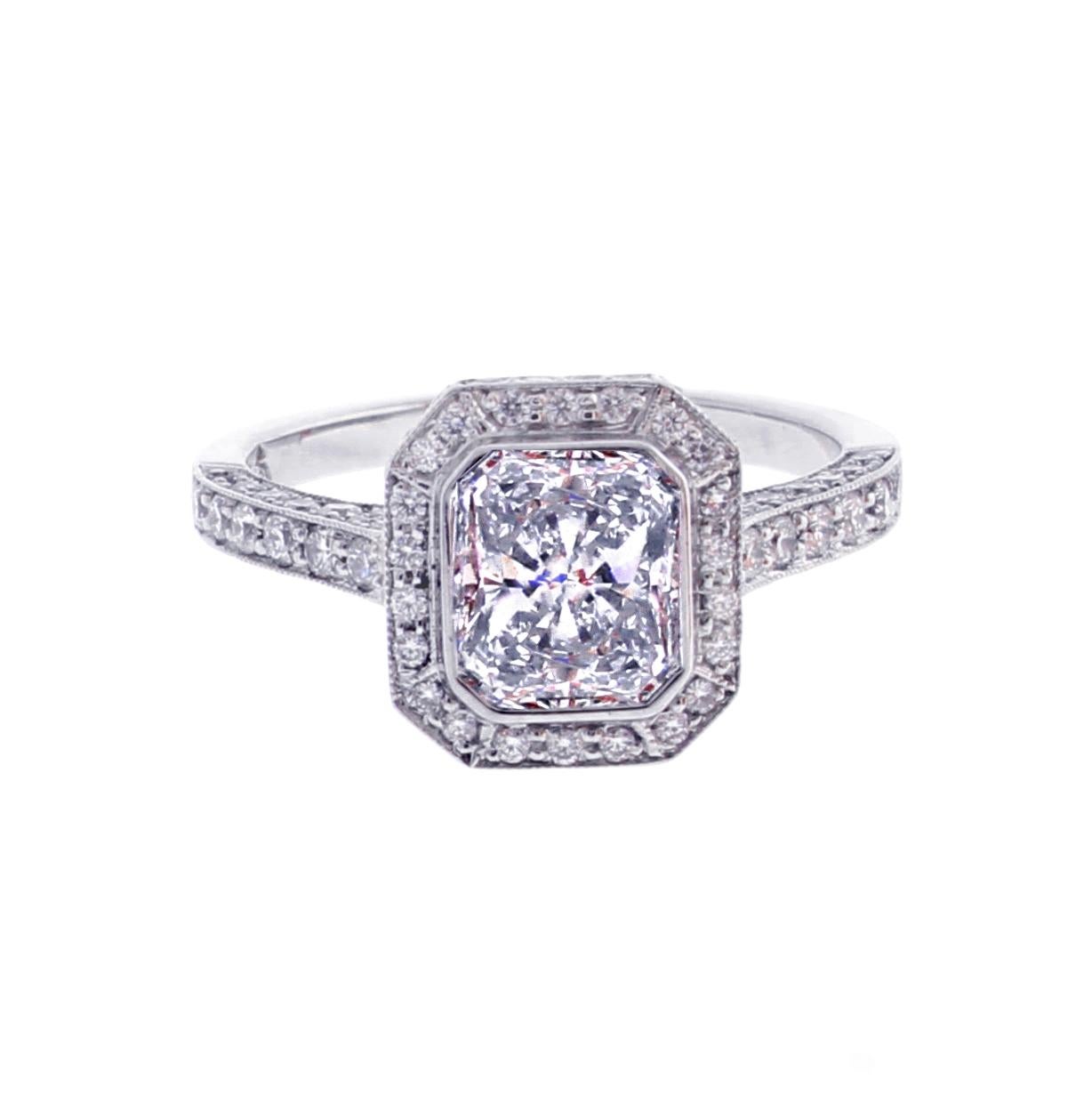 From the Master ring makers of Pampillonia Jewelers a radiant cut diamond framed by by brilliant diamonds. The diamonds are meticulously set on all three sides.
♦ Designer: Pampillonia
♦ Metal: Platinum
♦ Diamond=1.51 E color SI1 clarity  GIA