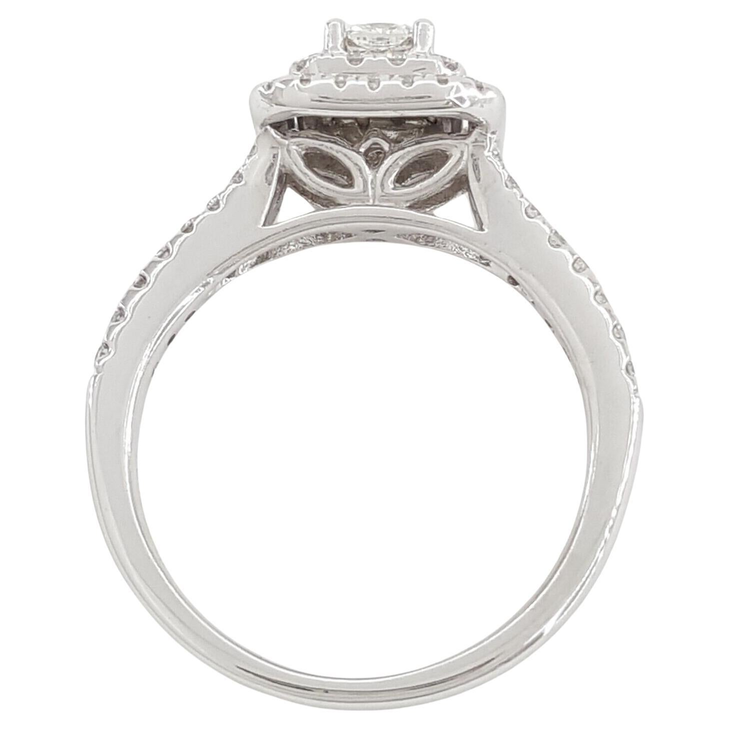 Weighing 3.1 grams and sized at 5, this 14k White Gold Engagement Ring showcases a Total Weight of 3/4 carats with a Cushion Cut Diamond and a Double Halo design. The central stone is a Natural Cut-Cornered Square Brilliant Cut Diamond, featuring