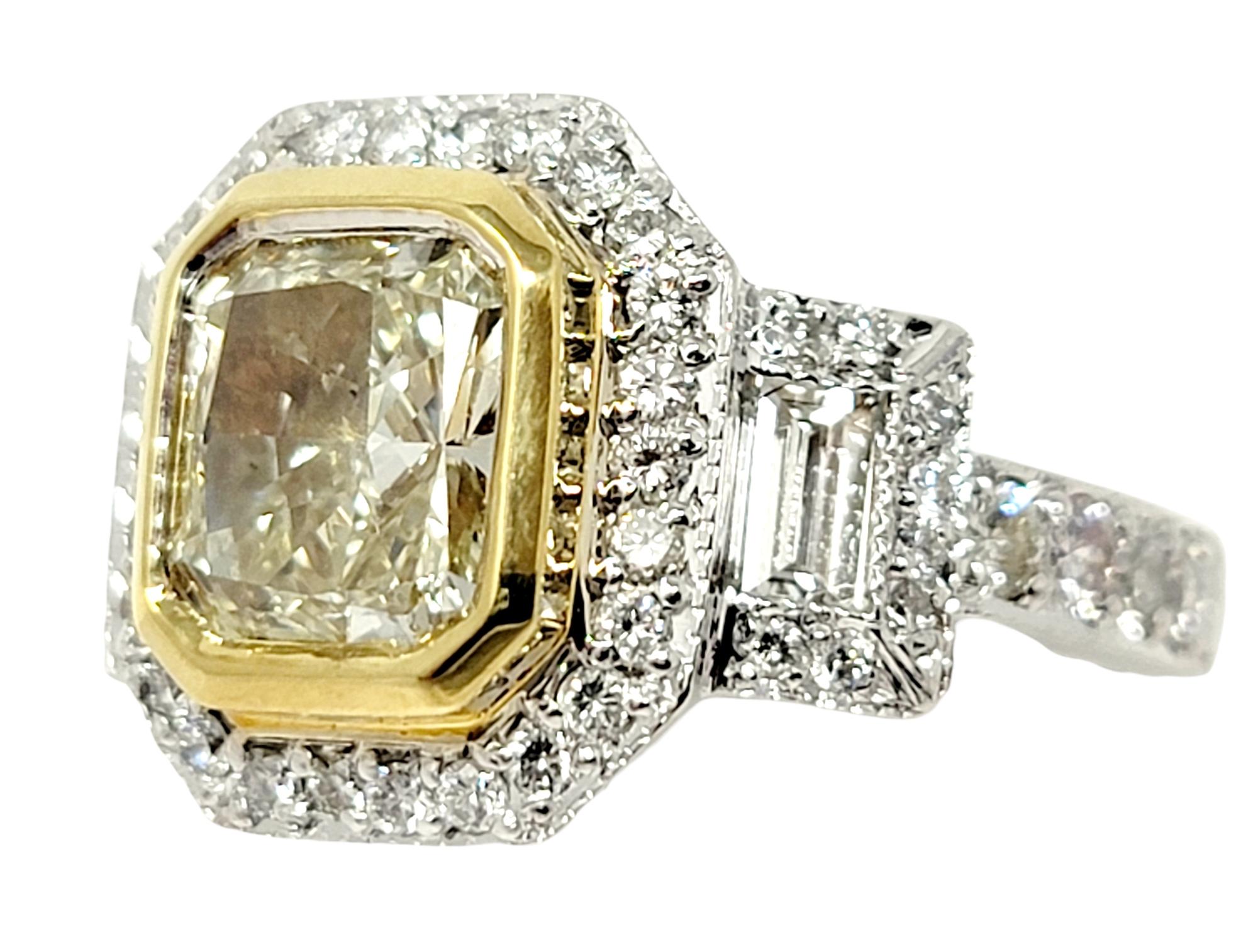 Ring size: 6

This stunning two-tone engagement ring will absolutely take your breath away! An exquisite natural light yellow diamond is paired with glittering white diamonds for an absolute work of art.  The gorgeous 1.50 carat radiant cut bezel