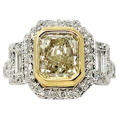 Radiant Cut Light Yellow Diamond and Baguette White Diamond Halo Engagement Ring