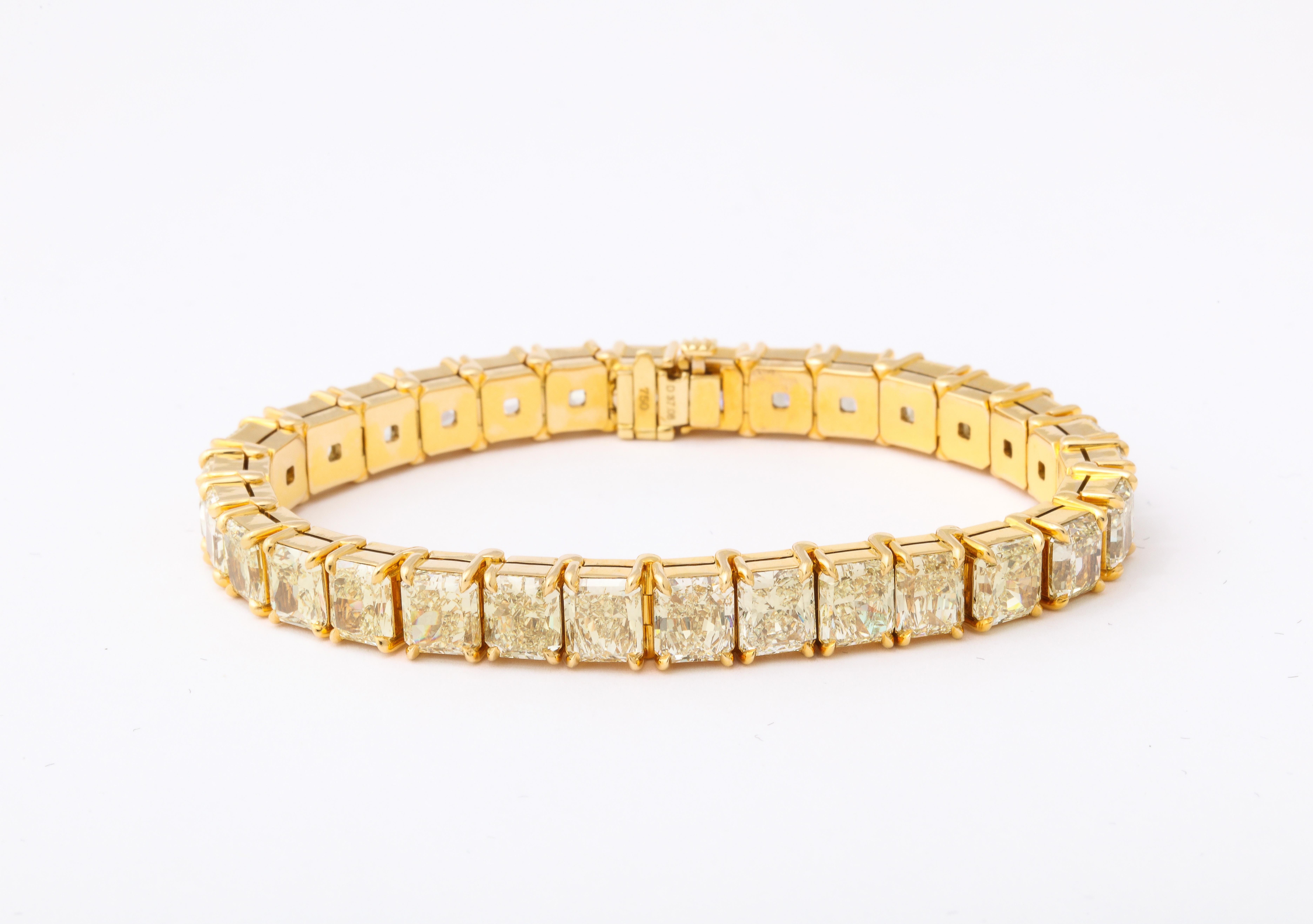 
A SPECTACULAR bracelet! 

37.08 carats of Yellow, Radiant cut diamonds set in 18k yellow gold. 

30 total diamonds - each stone averages over 1 carat! 

7 inch length 

7.8 mm at its widest point.  