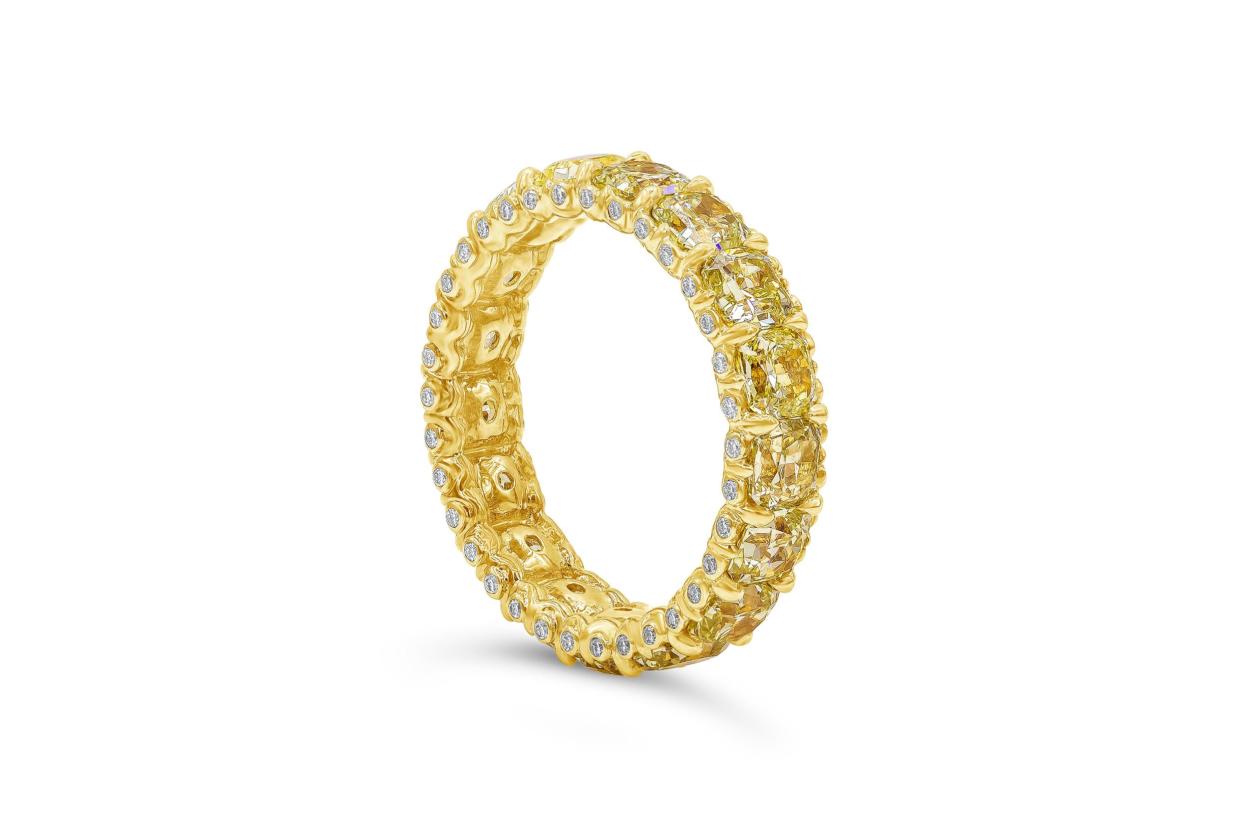 A stunning color-rich eternity wedding band showcasing a row of perfectly matched cushion cut diamonds weighing 4.80 carats total, Fancy Light Yellow in Color and VS in Clarity. Accented with brilliant round diamonds set on the side of gallery,