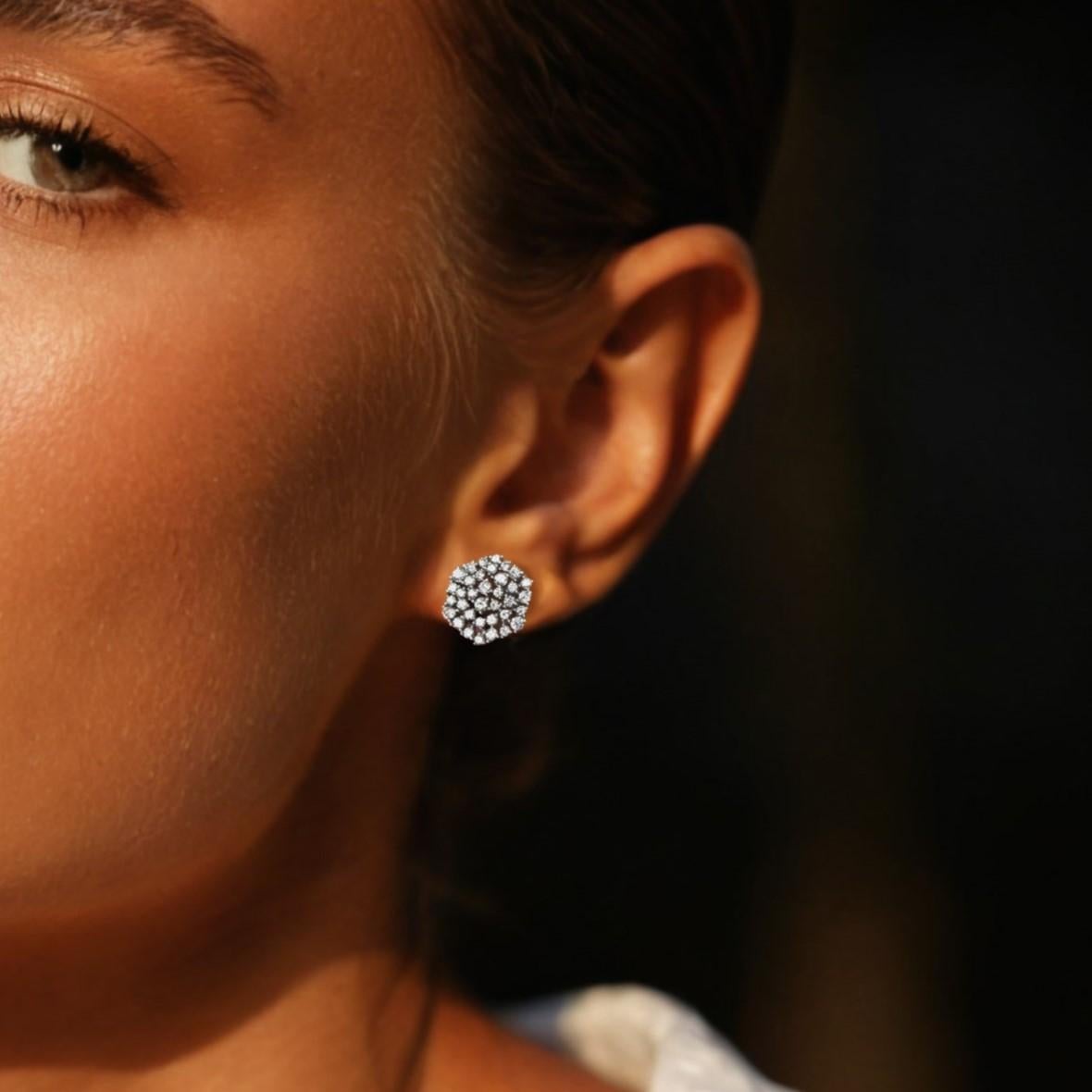 Timeless and elegant, these Brilliant Diamond Cluster Stud Earrings are a true celebration of sparkle and sophistication. Expertly crafted in solid 14K gold, each earring showcases a dazzling array of round-cut diamonds, artistically arranged in a