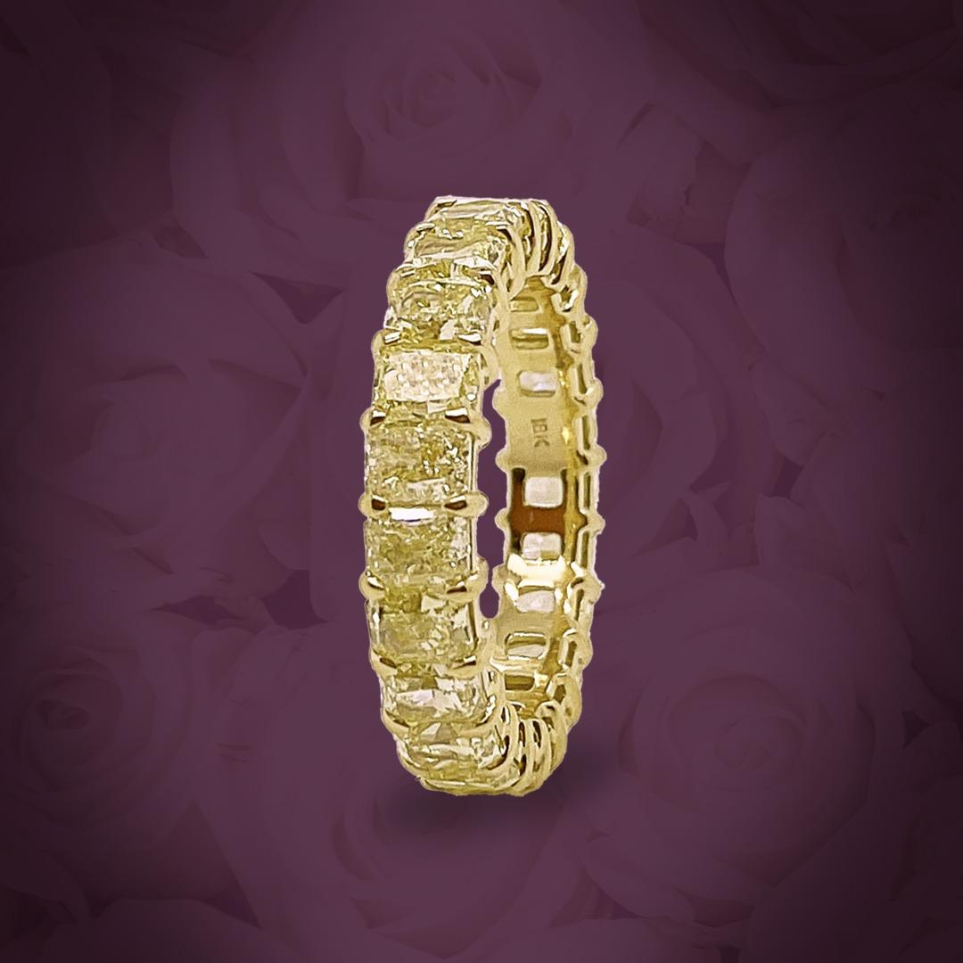 This fancy yellow Radiant diamond Eternity band is set in 18K Yellow Gold.
The ring has 23 Radiant diamonds and 5.77 total carat weight.
The Diamonds are Fancy Intense yellow color, and VS clarity.

This ring will come with an appraisal from a third
