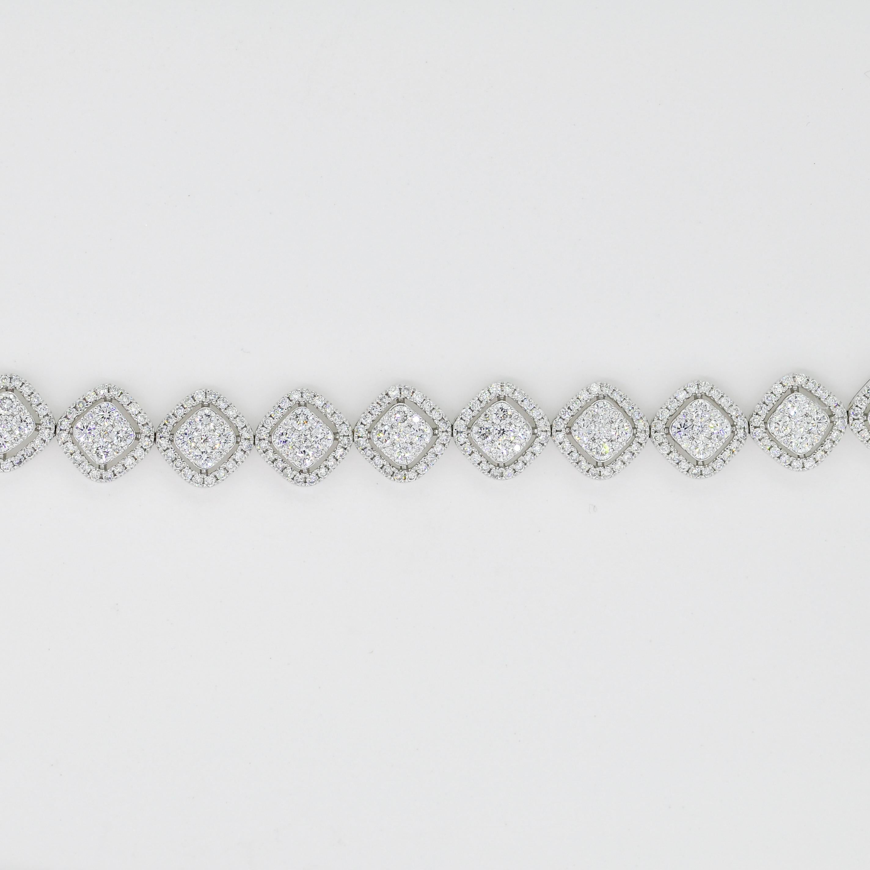 Experience the captivating allure of this modern 18K white gold bracelet with a cluster halo style. Meticulously crafted, it embodies elegance and sophistication. A mesmerizing array of natural diamonds takes center stage, arranged in a cluster