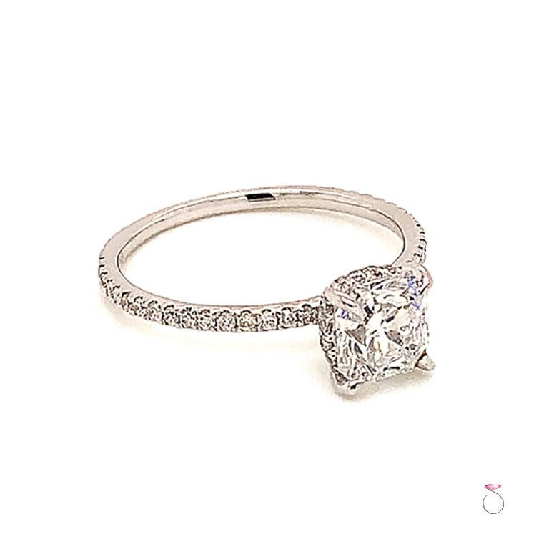 Elegant Diamond engagement ring with hidden halo in 18K white gold featuring a 1.05 carat Flanders cut corner square cut diamond, color D and clarity VS2 with GIA diamond report.  The diamond is set in four French claw prongs with a diamond hidden