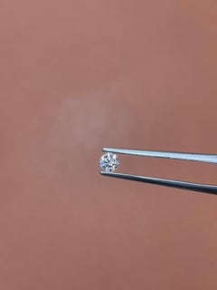 Radiant GIA Certified 0.25CT Fancy Pink Round Brilliant Diamond With VS1 Clarity