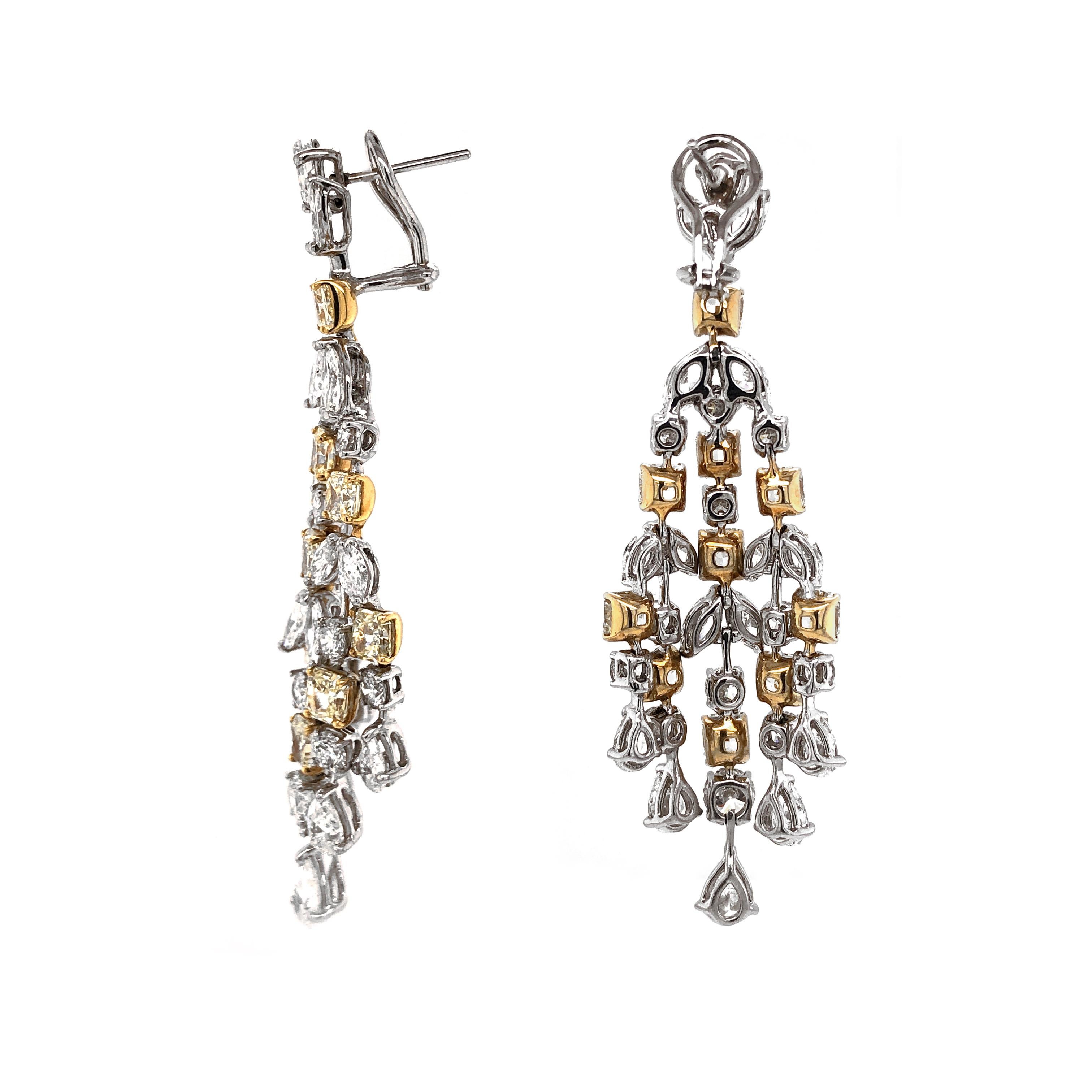 Handcrafted 18 karat white gold chandelier earrings.
Radiant cut yellow diamonds 11.49 ct.
Accented with pear, round, and marquise white diamonds 15.87 ct.
Diamonds are all natural in G-H Color Clarity VS. 
French / Omega clips.
Width: 2.5